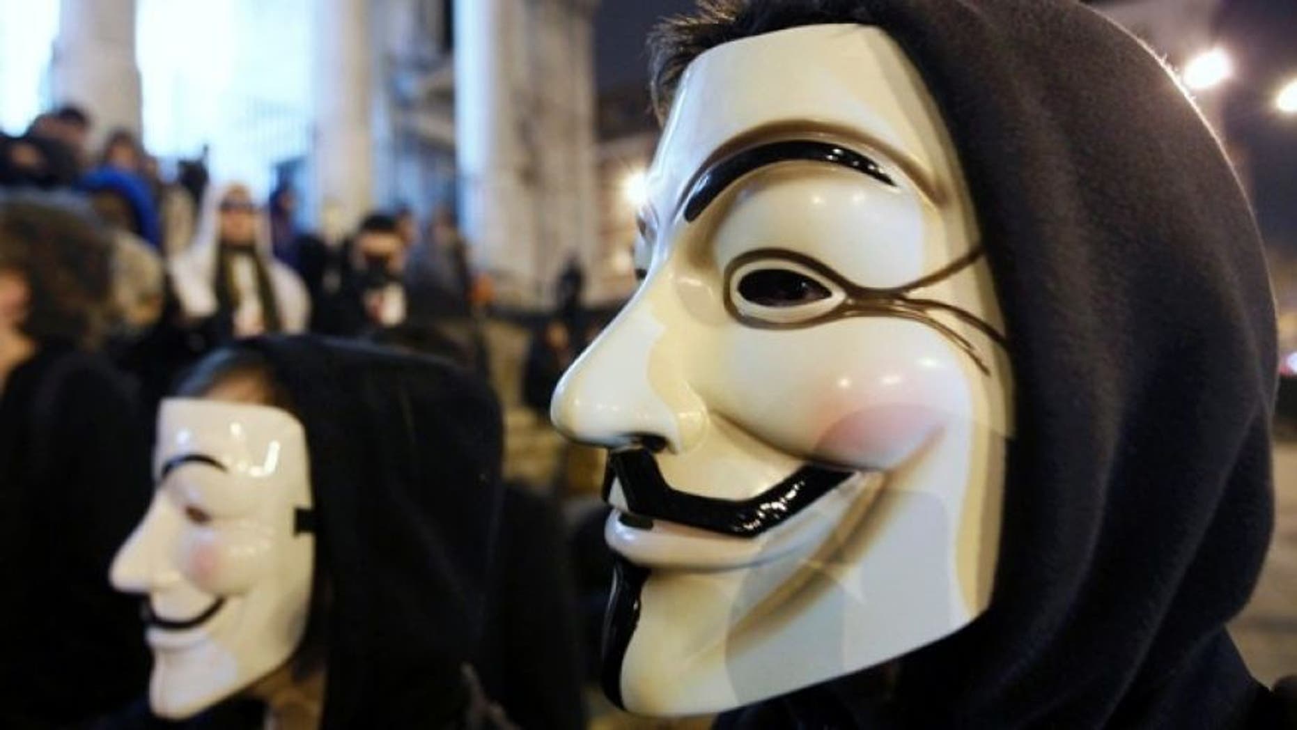 Jan. 28, 2012: A protester wearing a Guy Fawkes mask, symbolic of the hacktivist group "Anonymous", takes part in a protest in central Brussels.