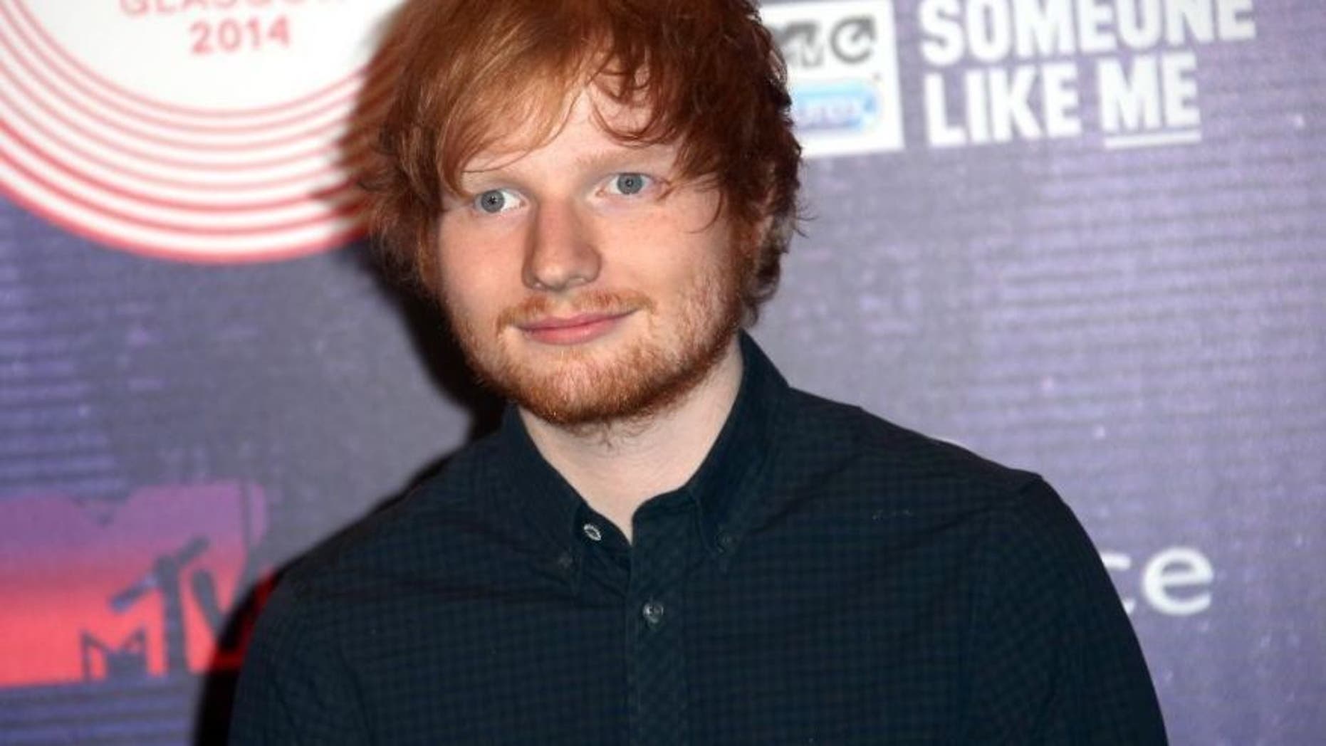 FILE - In this Nov. 9, 2014 file photo, singer-songwriter Ed Sheeran arrives for the 2014 MTV European Music Awards in Glasgow.