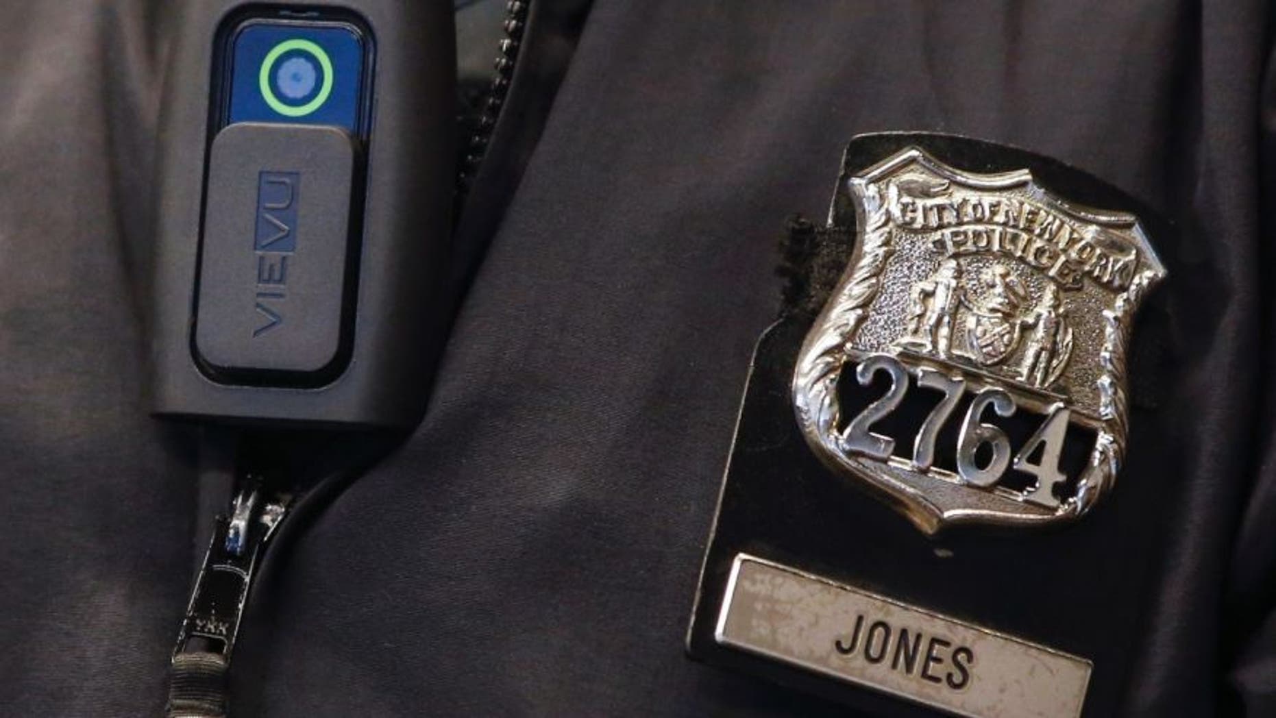 Dec. 3, 2014: A police body camera is seen on an officer during a news conference.