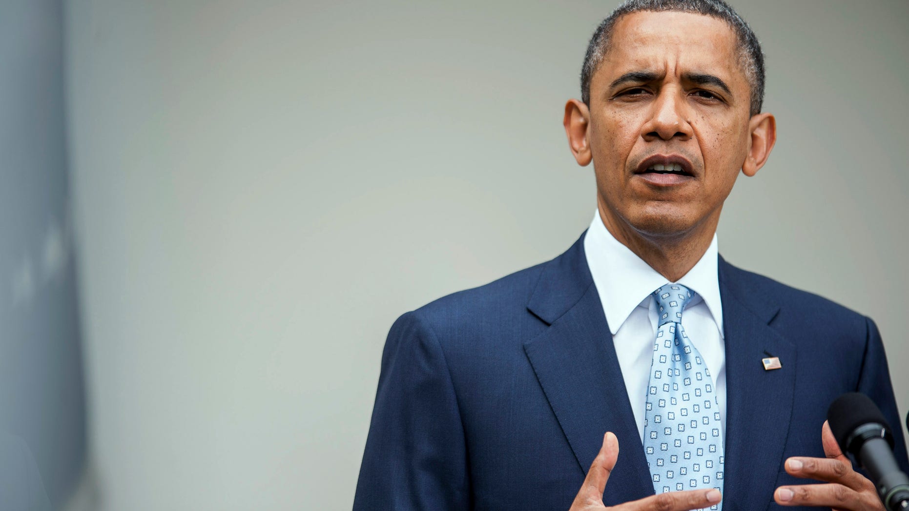 WASHINGTON, DC - APRIL 17: U.S. President Barack Obama (C) speaks about the oil markets in the Rose Garden of the White House on April 17, 2012 in Washington, DC. Obama announced a plan to increase oversight and crack down on manipulation of the oil markets. (Photo by Pete Marovich/Getty Images)