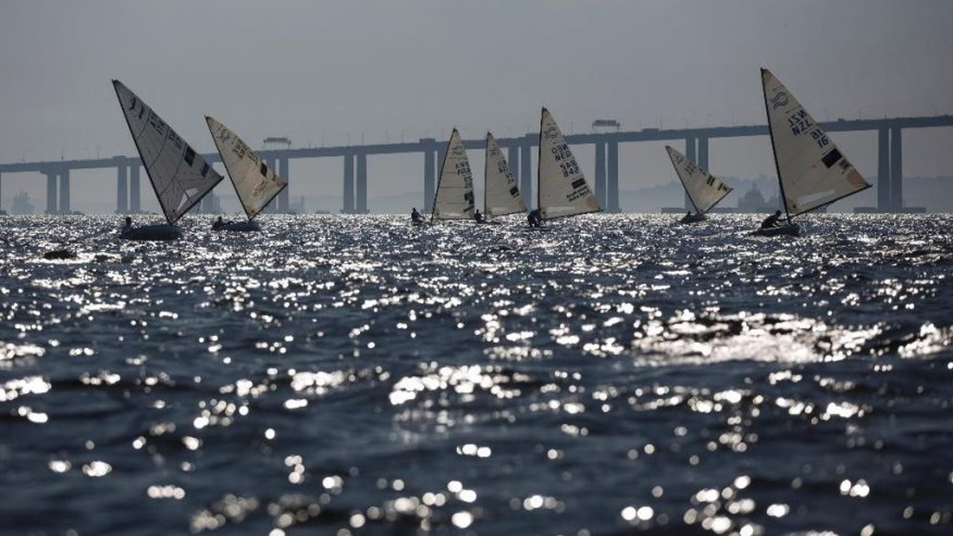 FILE - In this Aug. 3, 2014, file photo, athletes of the Finn class compete during the first test event for the Rio 2016 Olympic Games at the Guanabara Bay in Rio de Janeiro, Brazil.