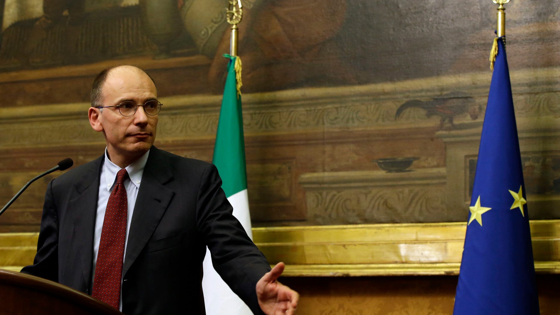 Italian premier-designate Enrico Letta meets the journalists at the lower chamber in Rome, Thursday, April 25, 2013, at the end of a day of meetings with of all of Parliament's forces, to secure as much support as possible to boost prospects of creating a government agenda that would balance measures for both austerity and growth. The center-left leader picked by Italy's president to form a coalition government worked doggedly Thursday to find common ground among bitterly opposed political blocs, which have been mired in deadlock for months. (AP Photo/Gregorio Borgia)