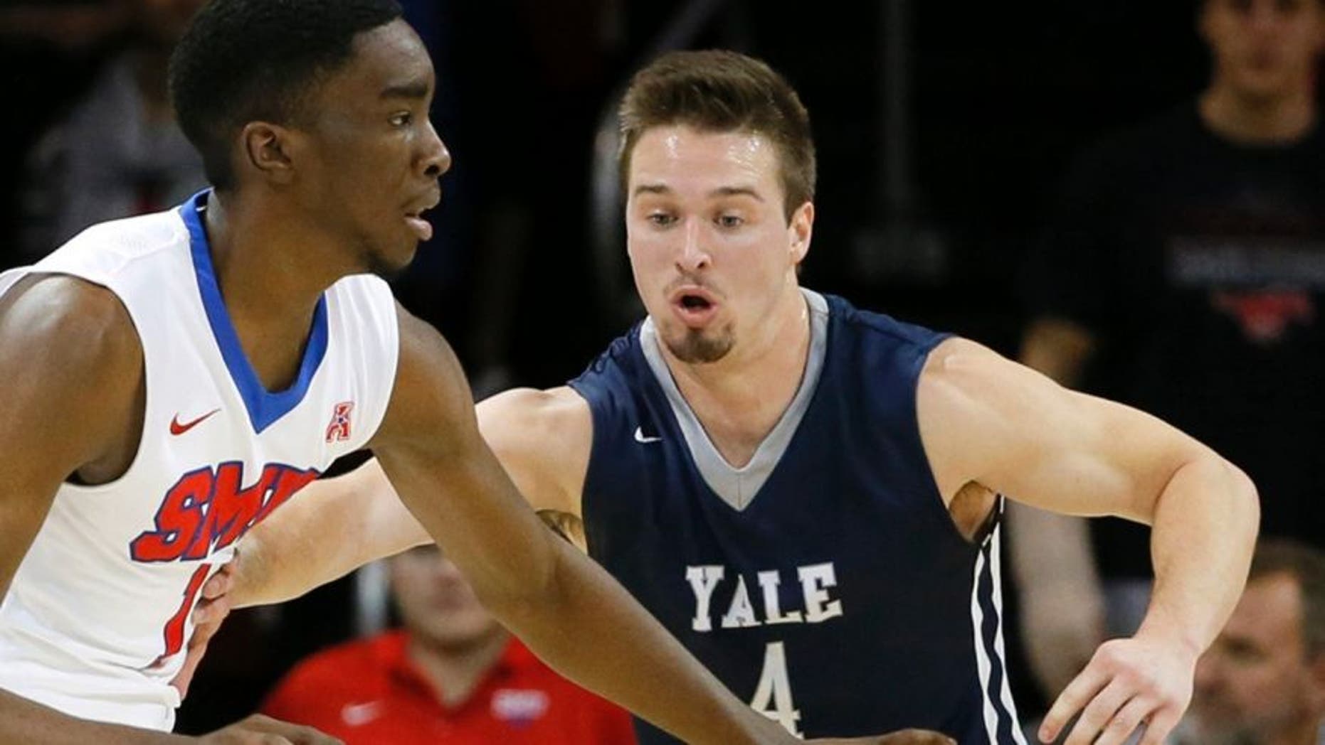 FILE - In this Nov. 22, 2015, file photo, Yale's Jack Montague, right, defends against SMU guard Shake Milton during an NCAA college basketball game in Dallas.