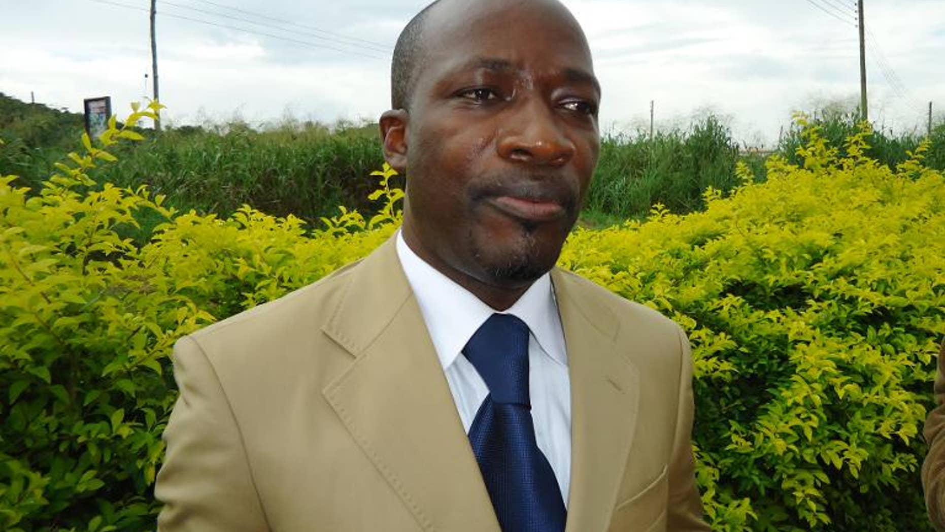 Charles Ble Goude, a former minister in the ousted Ivory Coast regime, speaks to a journalist somewhere close to the Togo-Benin border on June 25, 2012