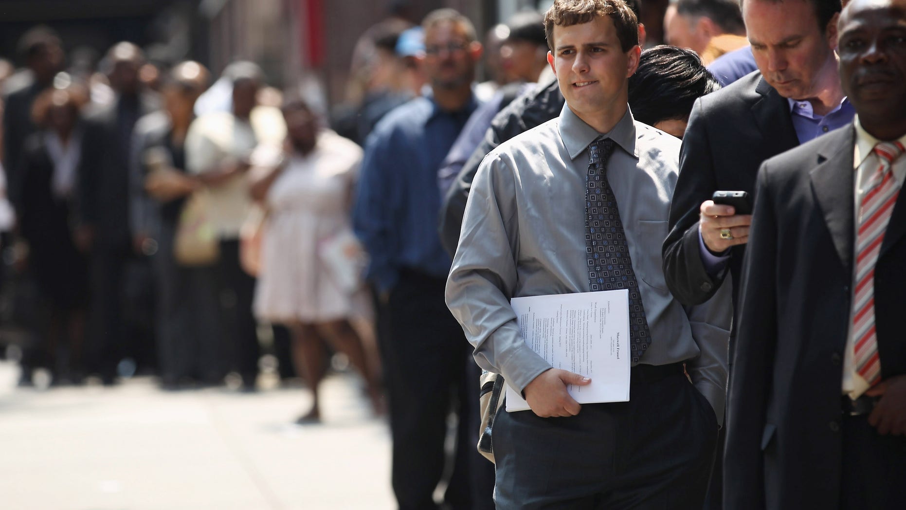 NEW YORK, NY - JUNE 11: Applicants wait to enter a job fair on June 11, 2012 in New York City. Some 400 people arrived early for the event held by National Career Fairs, and up to 1,000 people were expected by the end of the day. (Photo by John Moore/Getty Images)