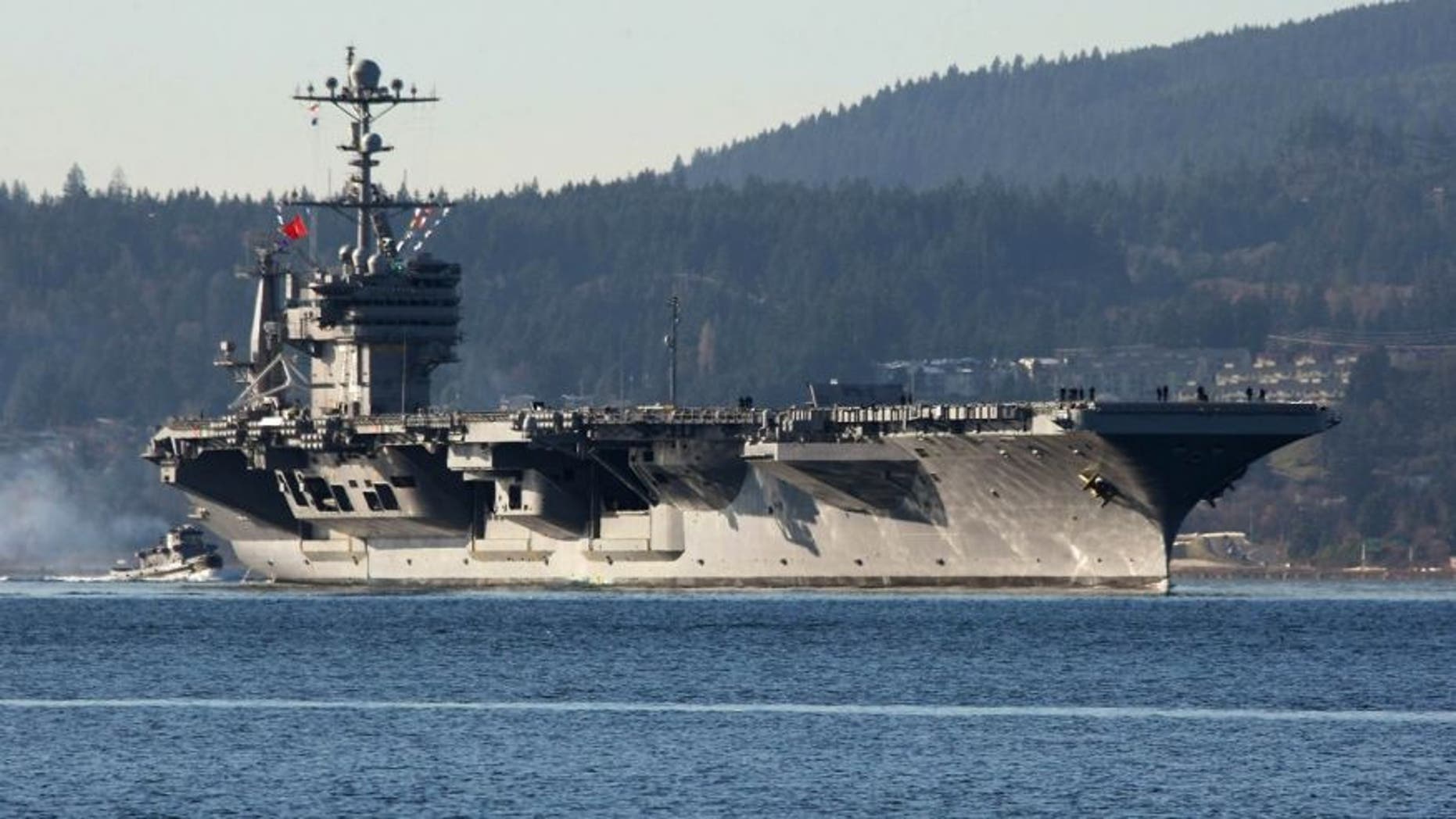 Dec. 1, 2014: FILE - In this photo Dec. 1, 2014 file photo, the aircraft carrier USS John Stennis seen near Bremerton, Wash.