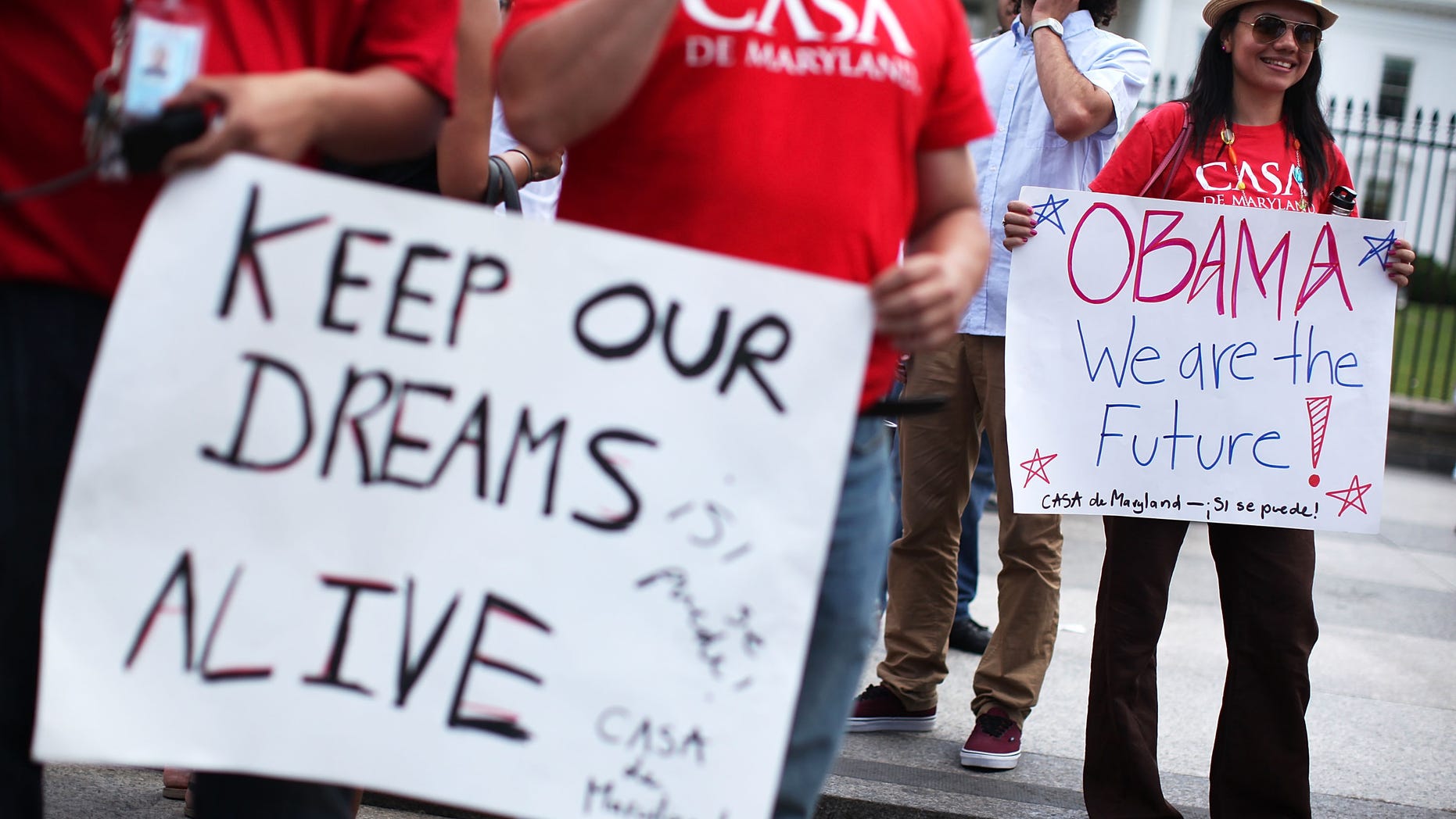 WASHINGTON, DC - JUNE 15: Members of CASA de Maryland gather in front of the White House to celebrate the Obama Administration's announcement about deportation of illegal immigrants June 15, 2012 in Washington, DC. Obama said the administration will stop deporting undocumented immigrants who had come to the U.S. when they were at a young age. (Photo by Alex Wong/Getty Images)