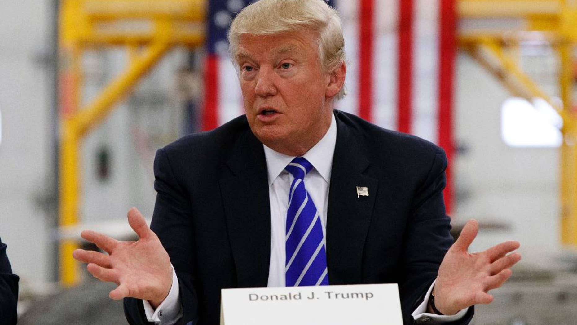 In this Aug. 10, 2016, photo, Republican presidential candidate Donald Trump speaks during a coal mining roundtable at Fitzgerald Peterbilt in Glade Spring, Va. (AP Photo/Evan Vucci)