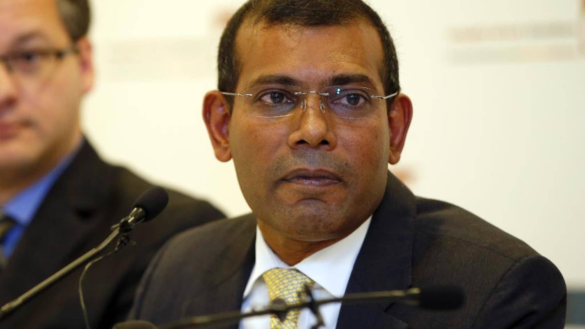 FILE - In a Jan. 25, 2016 file photo, former Maldives president Mohamed Nasheed listens to a question during a press conference in London. The former president of the Maldives said Monday, May 23, 2016, that he's been granted political asylum in Britain where he had traveled for medical treatment on leave from serving a prison sentence in his country. Nasheed, who was the Indian Ocean archipelago's first democratically elected leader, was sentenced to 13 years in prison last year for ordering the arrest of a senior judge while in office. (AP Photo/Alastair Grant, File)