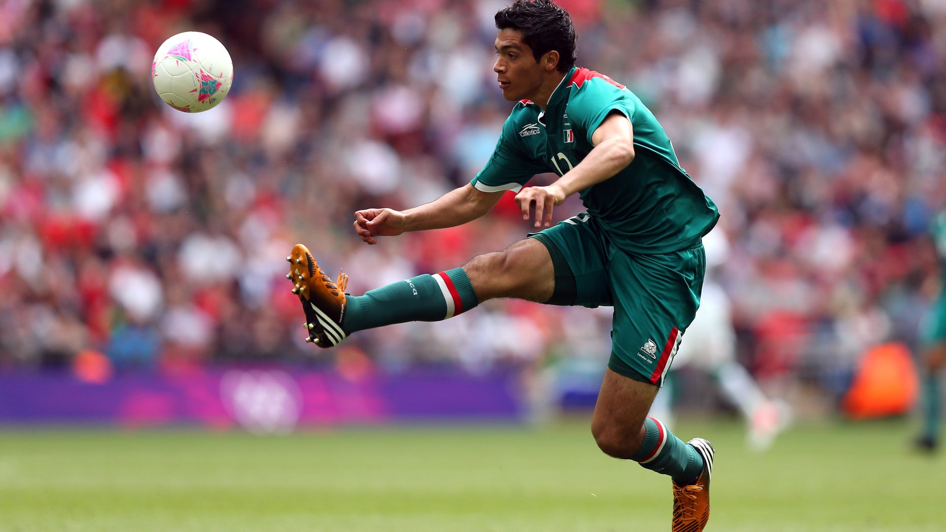 LONDON, ENGLAND - AUGUST 04: Raul Jimenez of Mexico leaps for the ball during the Men's Football Quarter Final match between Mexico and Senegal, on Day 8 of the London 2012 Olympic Games at Wembley Stadium on August 4, 2012 in London, England. (Photo by Ezra Shaw/Getty Images)
