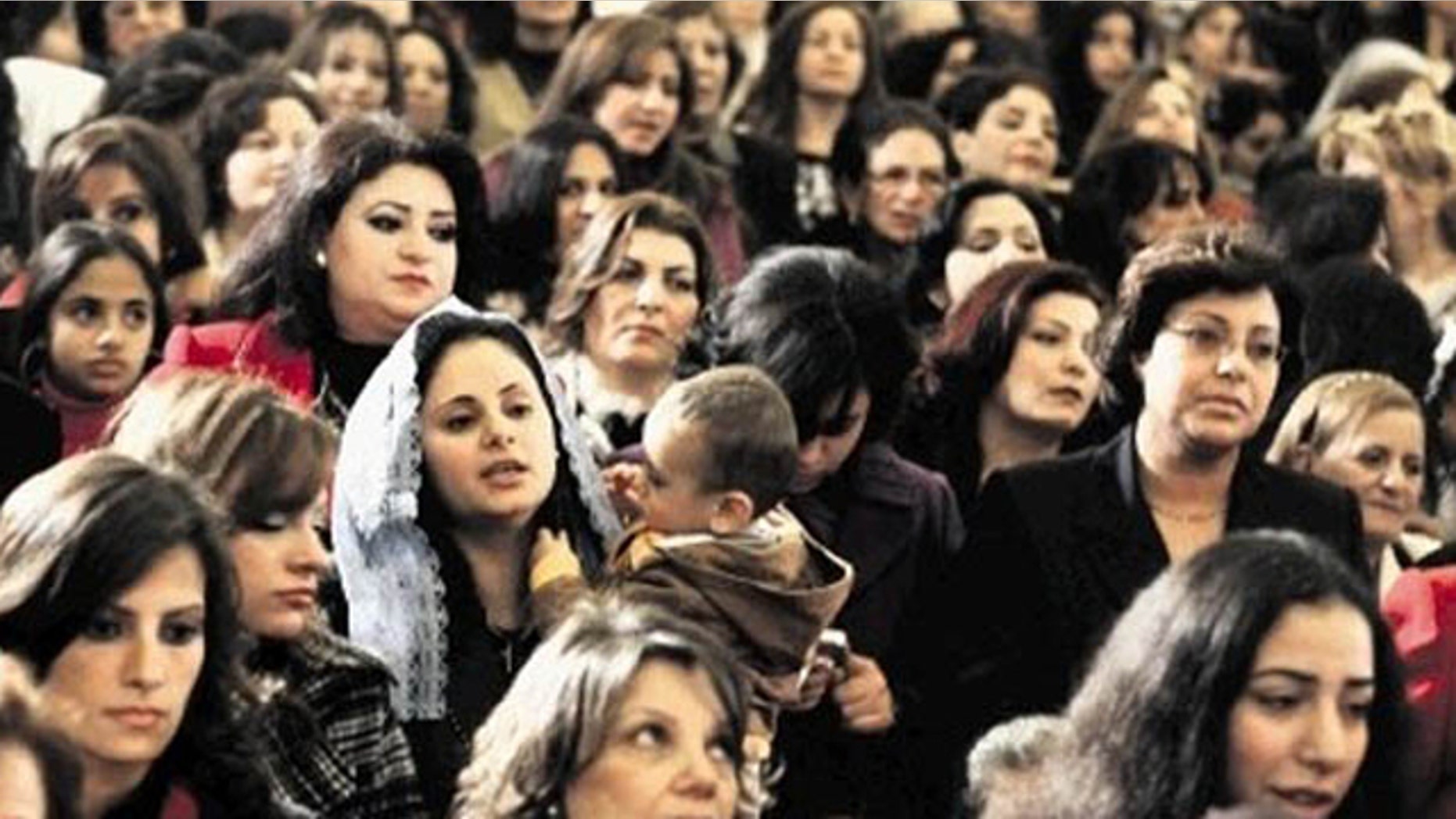 In this AP FILE photo Copts gather to celebrate Christmas in a Cairo Church.