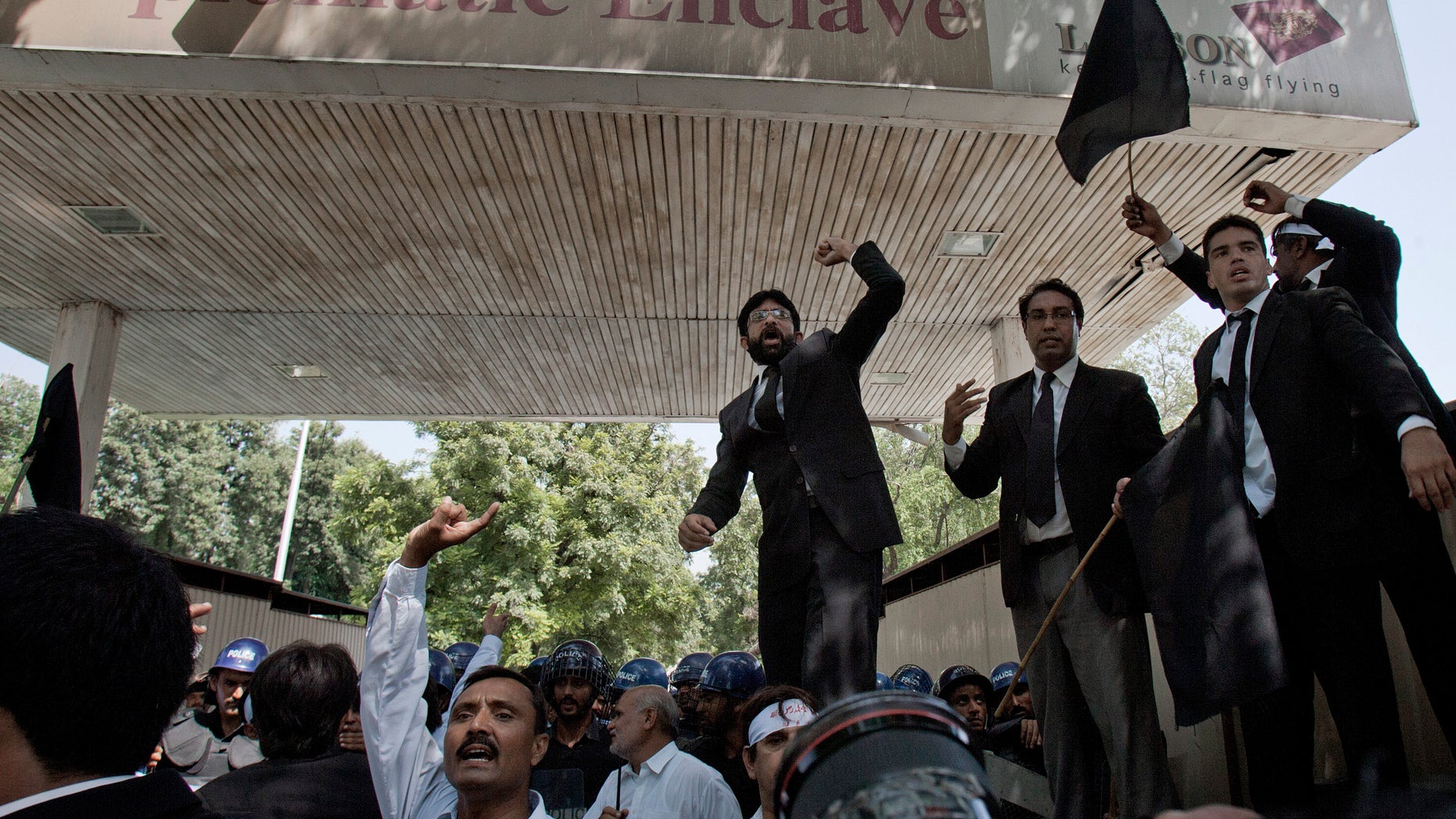 Pakistani lawyers chant anti-U.S. slogans during a demonstration, near an area that houses the U.S. Embassy and other foreign missions in Islamabad, Pakistan on Wednesday, Sept. 19, 2012. The demonstration in Islamabad followed three days of violent protests against an anti Islam film in Pakistan in which two people were killed. Over two dozen more have been killed in protests in other parts of the Muslim world over the past week, including the U.S. ambassador in Libya. (AP Photo/Anjum Naveed)
