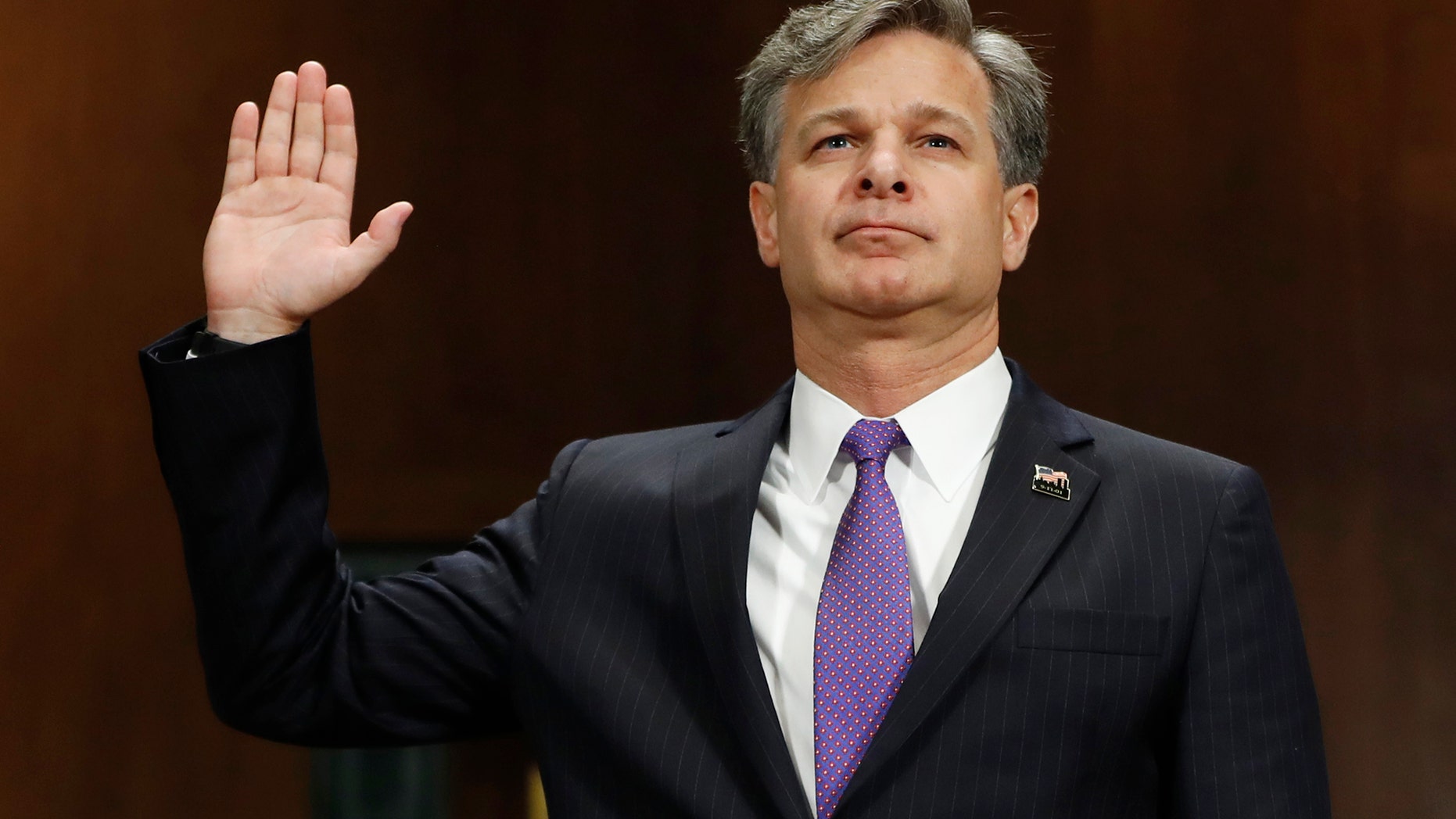 FBI Director nominee Christopher Wray is sworn-in on Capitol Hill in Washington, Wednesday, July 12, 2017, prior to testifying at his confirmation hearing before the Senate Judiciary Committee. (AP Photo/Pablo Martinez Monsivais)