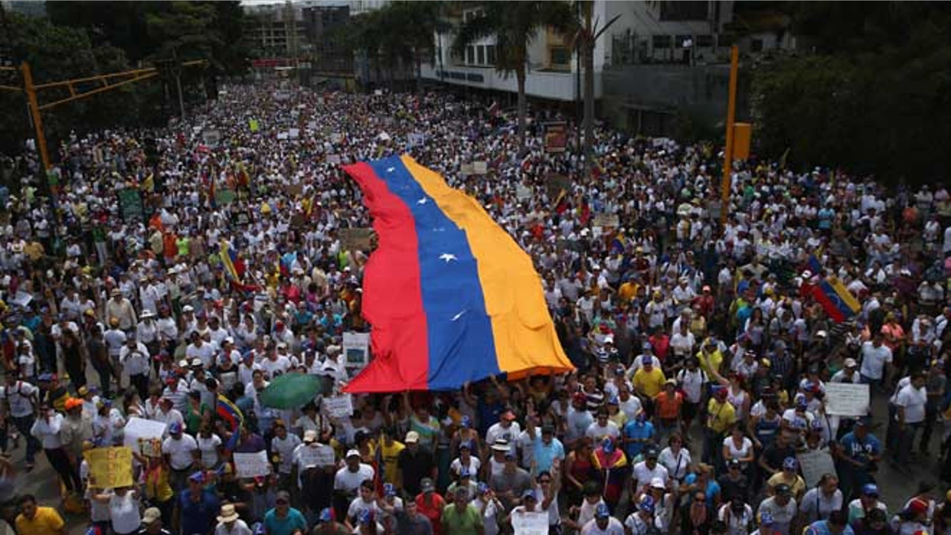 Anti-government protesters in Caracas, Venezuela. (Photo by John Moore/Getty Images)