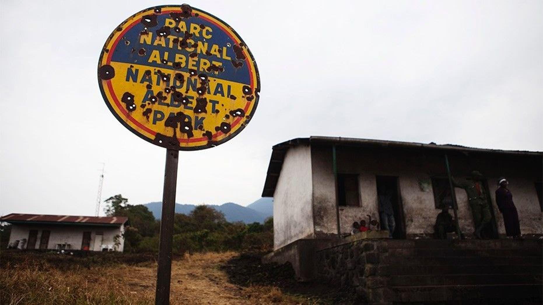 A bullet riddled sign marks the entrance to Virunga National Park, occupied by rebels and other armed militias during years of conflict near Goma in eastern Congo. (Reuters)