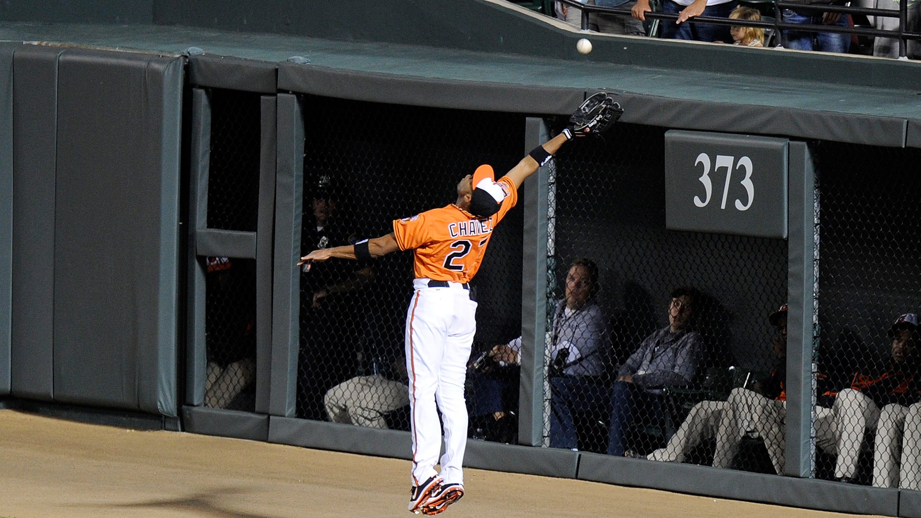 BALTIMORE, MD - SEPTEMBER 24: Endy Chavez #27 of the Baltimore Orioles makes a catch up against the wall in the first inning against the Toronto Blue Jays at Oriole Park at Camden Yards on September 24, 2012 in Baltimore, Maryland. (Photo by Greg Fiume/Getty Images)