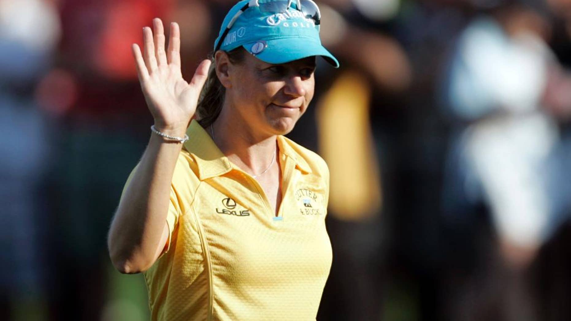 FILE- In this Dec. 14, 2008, file photo, Sweden's Annika Sorenstam waves to supporters following the end of the final round of the Dubai Ladies Masters golf tournament in Dubai, United Arab Emirates. Sorenstam will captain the European Solheim Cup team next year in Des Moines, Iowa, the Ladies European Tour announced, Wednesday, March 30, 2016. (AP Photo/Kamran Jebreili, File)