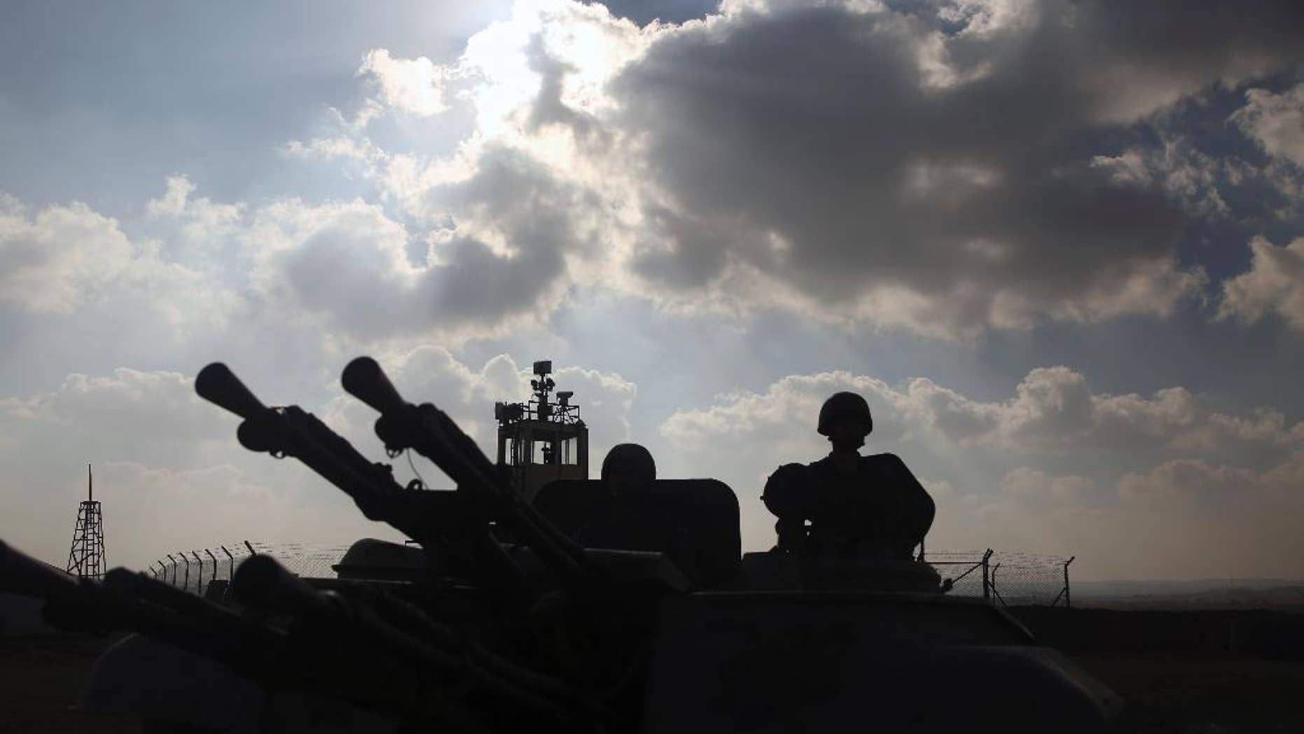 Jordanian border guards at a the Thneibeh position on the western-most stretch along the kingdom's border with Syria on Thursday, Jan. 19, 2017. The head of the country's border guard, Brig. Gen. Sami Kafawin warned Thursday that Jordan faces a mounting threat as Islamic State extremists in neighboring Syria and Iraq are being dislodged from strongholds by military offensives. (AP Photo/Omar Akour)