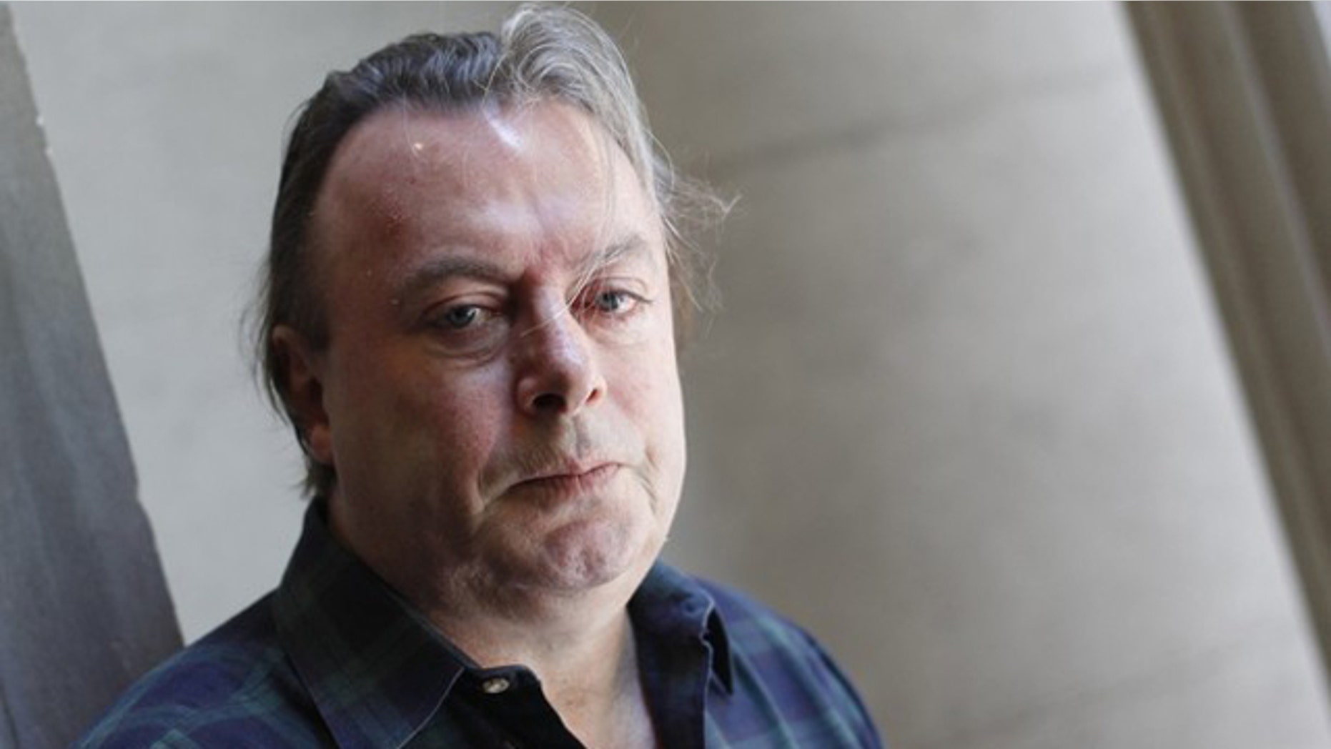 June 7, 2010: Journalist and author Christopher Hitchens poses for a portrait outside his hotel in New York.