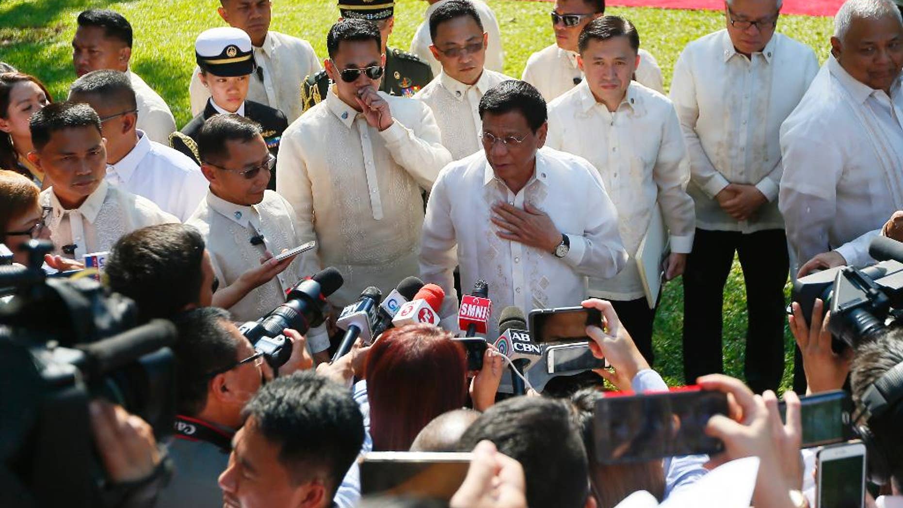 Philippine President Rodrigo Duterte talks to the media prior to a welcoming ceremony for Indonesian President Joko Widodo, at Malacanang Palace grounds in Manila, Philippines Friday, April 28, 2017. When Duterte hosts a summit of Southeast Asian leaders this weekend, the spotlight will be on him. Just less than a year in power, Duterte faces a mass murder complaint before the International Criminal Court and an impeachment bid at home as bodies continue to pile up in his war on illegal drugs.(AP Photo/Bullit Marquez)
