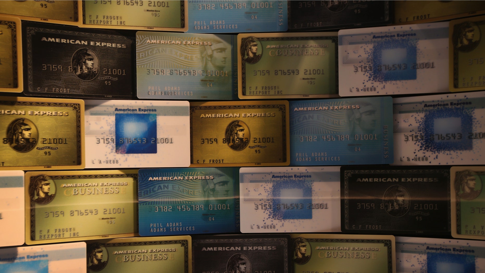 NEW YORK, NY - JANUARY 11: Credit cards fill a window display at American Express headquarters on January 11, 2013 in New York, New York. Following low fourth quarter earnings, the credit card giant announced plans to cut 5,400 jobs in the coming year. (Photo by John Moore/Getty Images)