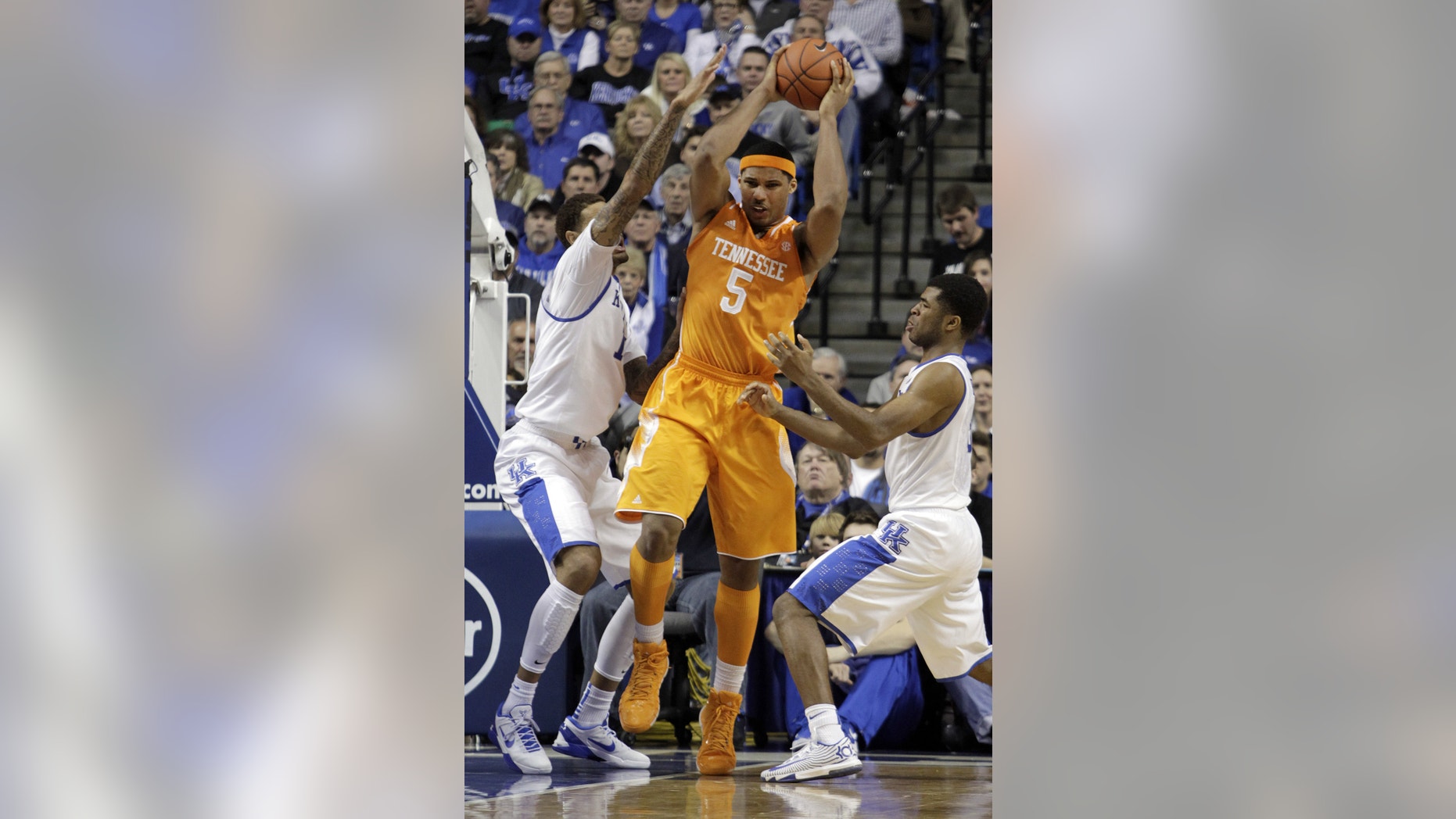 FILE - In htis Jan. 18, 2014, file photo, Tennessee's Jarnell Stokes (5) is pressured by Kentucky's James Young, left, and Andrew Harrison during the second half of an NCAA college basketball game in Lexington, Ky. Stokes' 20-point, 15-rebound outing Saturday in a 74-66 loss at Kentucky showed he's capable of delivering dominant efforts. (AP Photo/James Crisp, File)