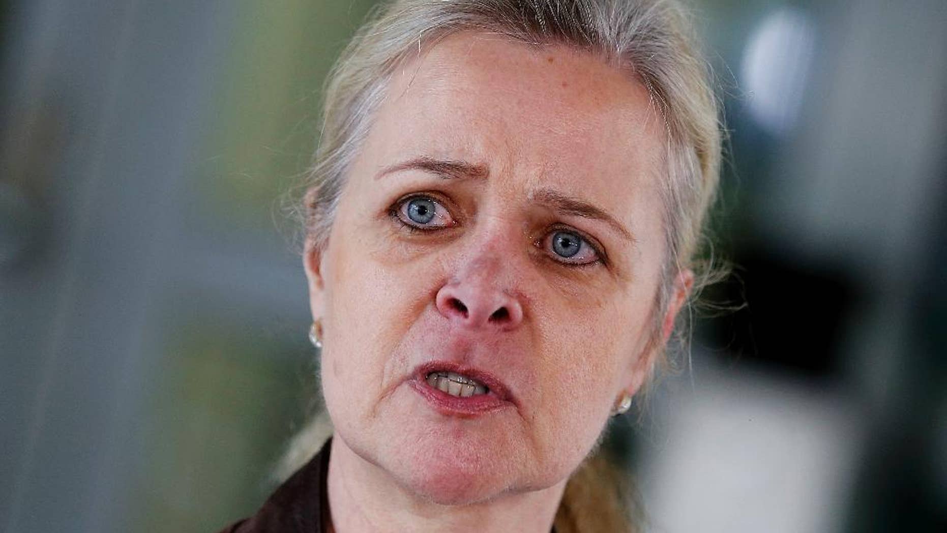 State's attorney Nadja Niesen talks to media people in Frankfurt, Germany, Thursday, April 27, 2017, after police have arrested a German soldier who had posed as a Syrian refugee on suspicion he was planning an attack, apparently motivated by anti-foreigner sentiment, in a case that German prosecutors said Thursday was "more than strange." (AP Photo/Michael Probst)