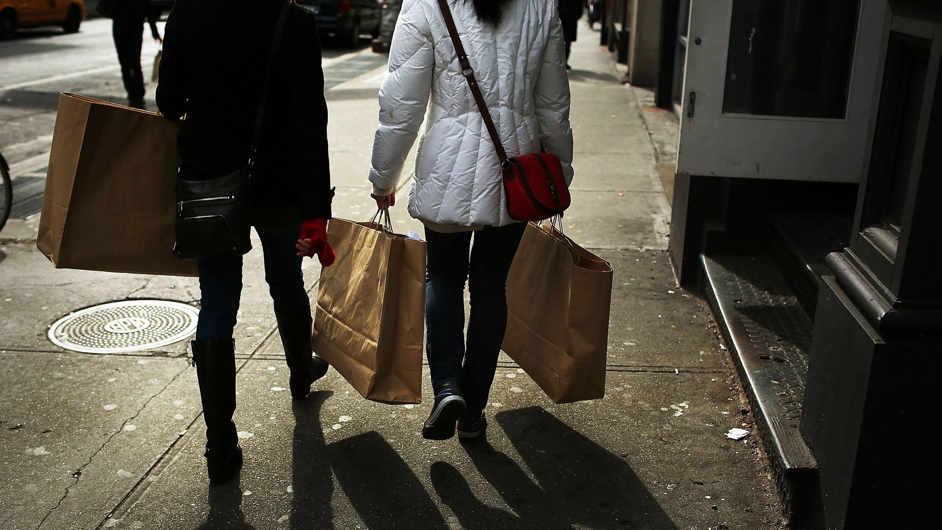 NEW YORK, NY - FEBRUARY 07: Women walk down Broadway with shopping bags on February 7, 2013 in New York City. In another indicator of a slowly strengthening economy, chain stores including Macy's Inc., Target Corp and Gap Inc. reported today January sales that exceeded analysts' estimates. (Photo by Spencer Platt/Getty Images)