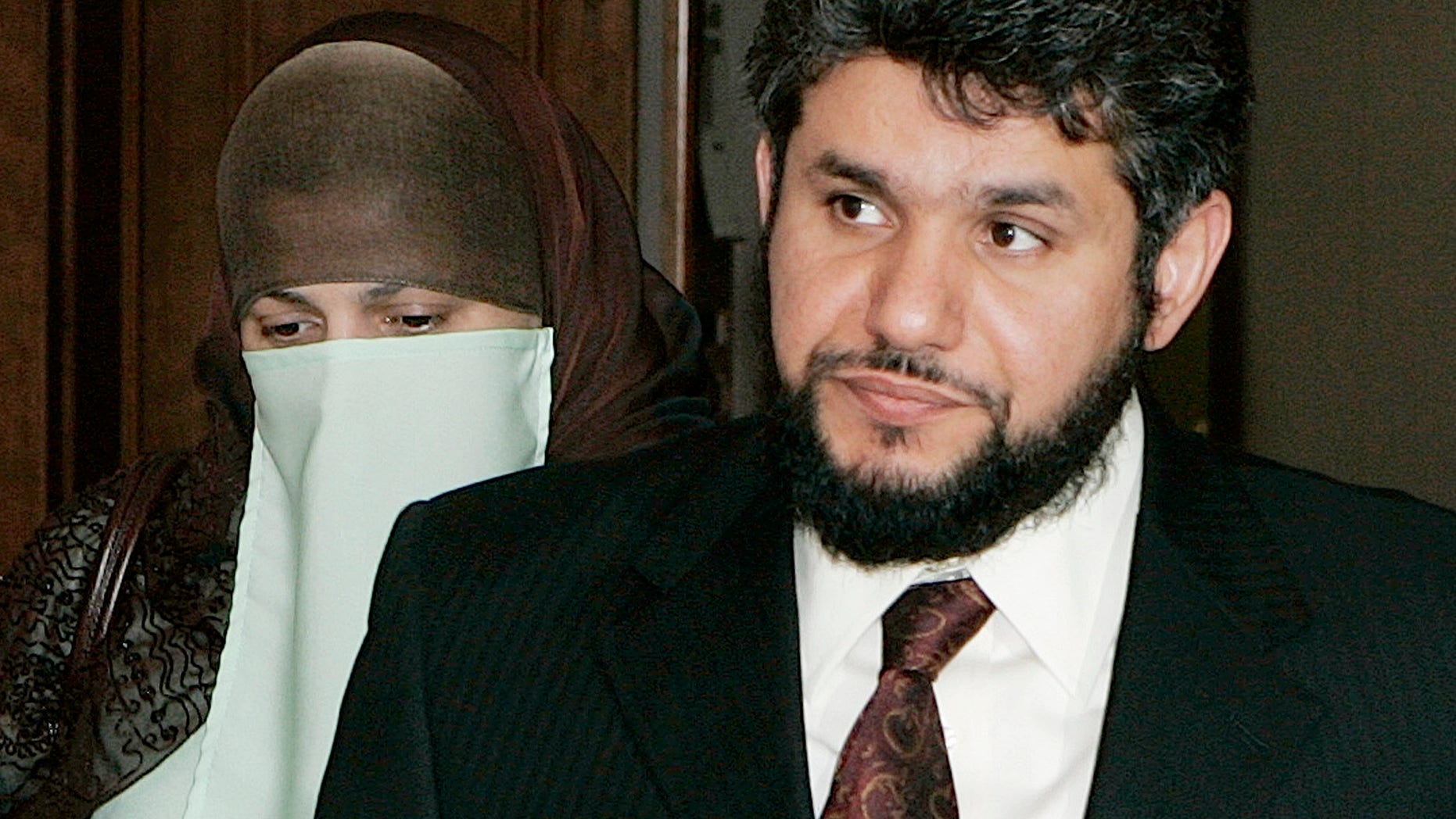 FILE - In this May 12, 2006 file photo, Sarah Khonaizan. left, and her husband Homaidan Al-Turki, both Saudi citizens, arrive at the Arapahoe County courthouse in Centennial, Colo. Angel Medina, assistant director of the Colorado Department of Corrections, testified Thursday, Oct. 31, 2013 that officials investigated Homaidan al-Turki in the March slaying of Colorado’s prisons chief but apparently found nothing to link him to the killing. (AP Photo/Ed Andrieski,File)