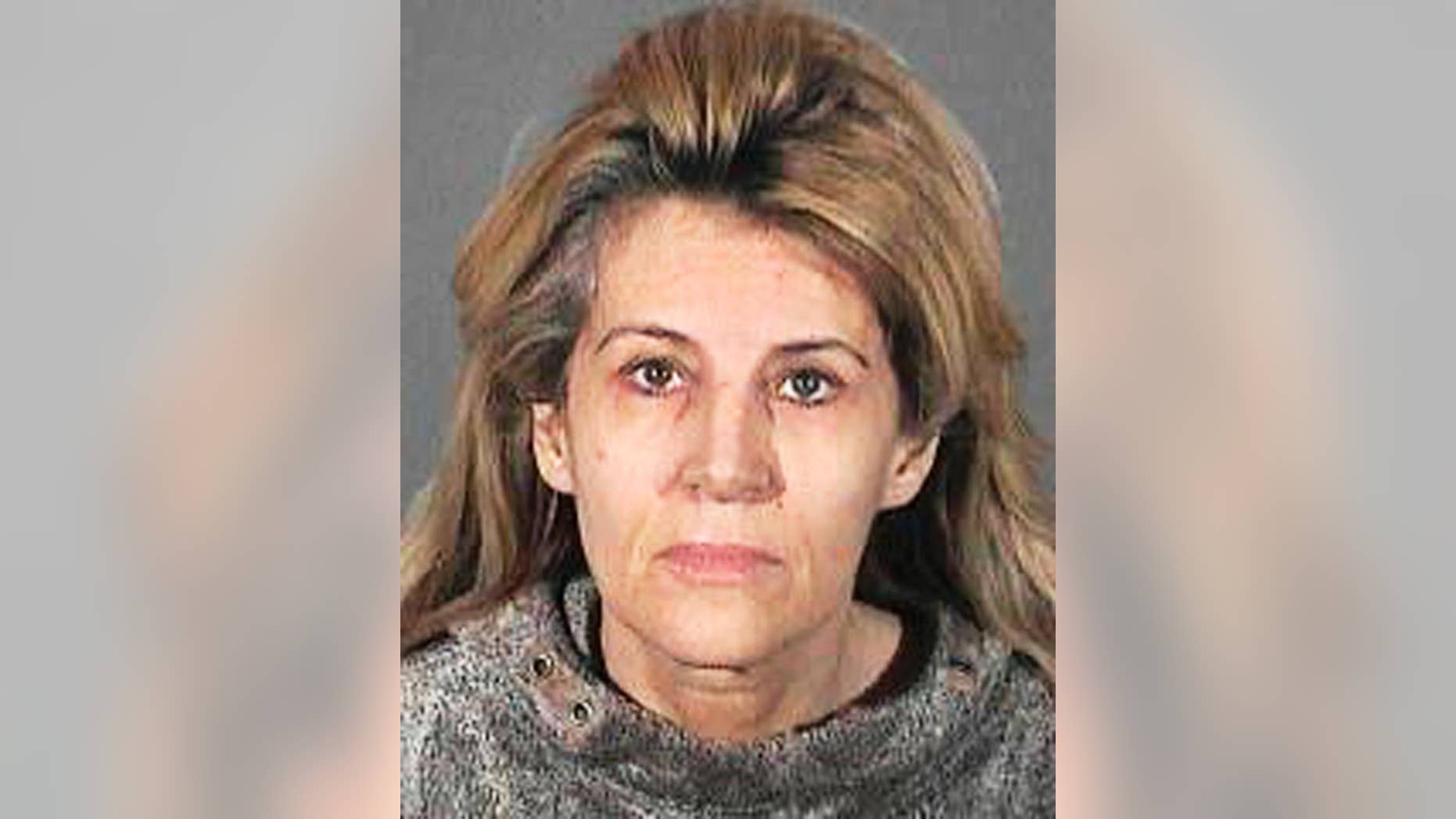 This undated handout booking photo from the Los Angeles County Sheriff shows Dawn DaLuise. DaLuise, 55, was arrested after authorities say she tried to hire someone to kill a business rival she mistakenly thought was behind a cyber-stalking campaign, which included lewd flyers, emails and Craigslist ads with her address seeking men to act out a "rape fantasy." Authorities recently arrested a suspect in the case, which was not the man she sought to have killed. (AP Photo/Los Angeles County Sheriff)