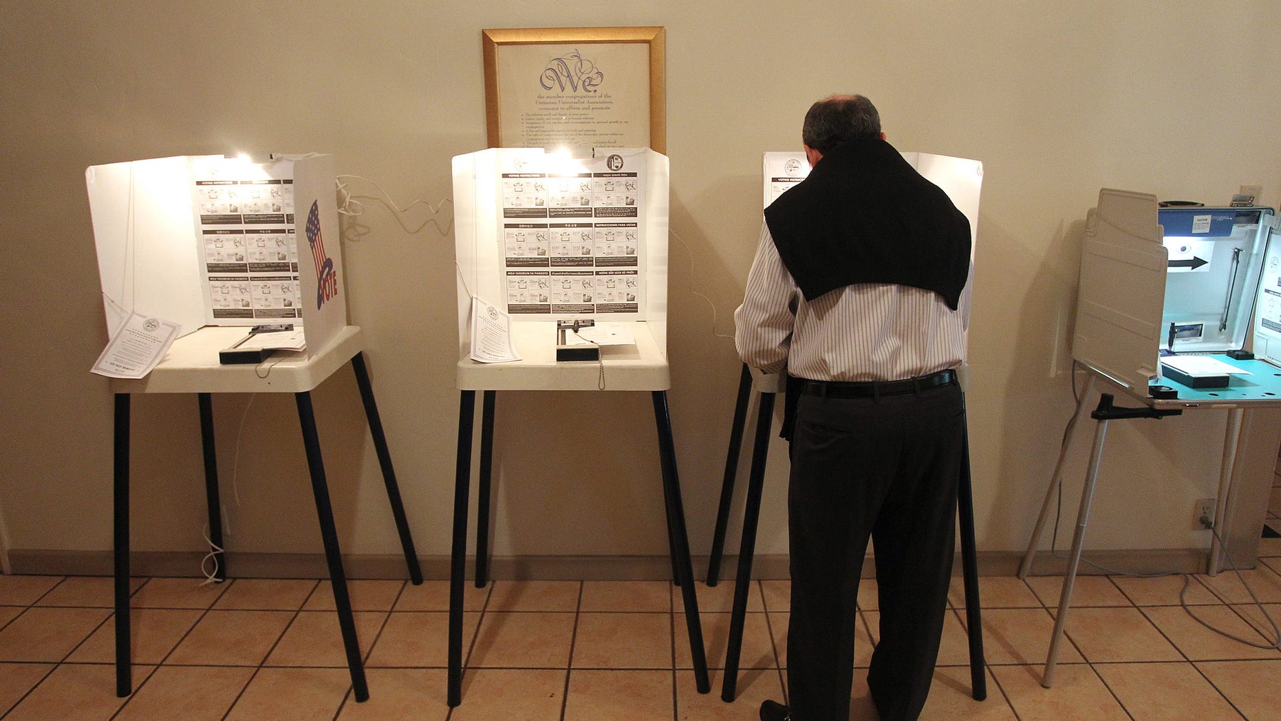 LOS ANGELES, CA - MAY 21: A man marks his ballot in an election that is expected to have very low voter turnout for the race between Los Angeles City Controller Wendy Greuel and Councilman Eric Garcetti for Los Angeles mayor on May 21, 2013 in Los Angeles, California. Greuel could become the first-ever woman mayor of Los Angeles in her bid to replace two-time mayor Antonio Villaraigosa. (Photo by David McNew/Getty Images)