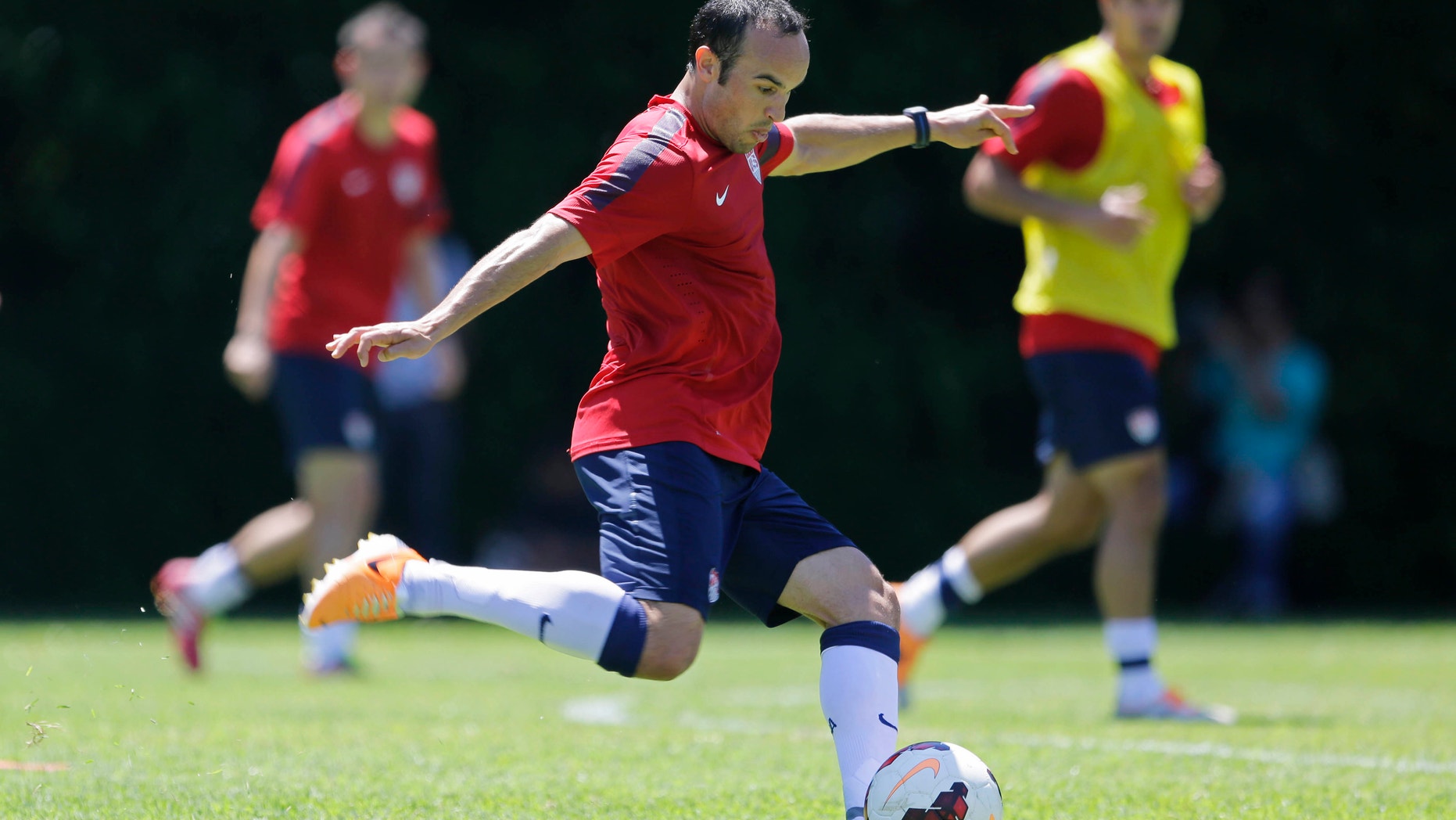 FILE - In this Jan. 22, 2014, file photo, United States' Landon Donovan kicks the ball during a soccer training session in Sao Paulo. Donovan and the U.S. soccer team are back home after a 12-day camp in Brazil, and they're ready to start figuring out how the pieces will fit at the World Cup. Even with several key players, in Europe, coach Jurgen Klinsmann hopes to learn a little more in Saturday's exhibition against South Korea. (AP Photo/Nelson Antoine, File)