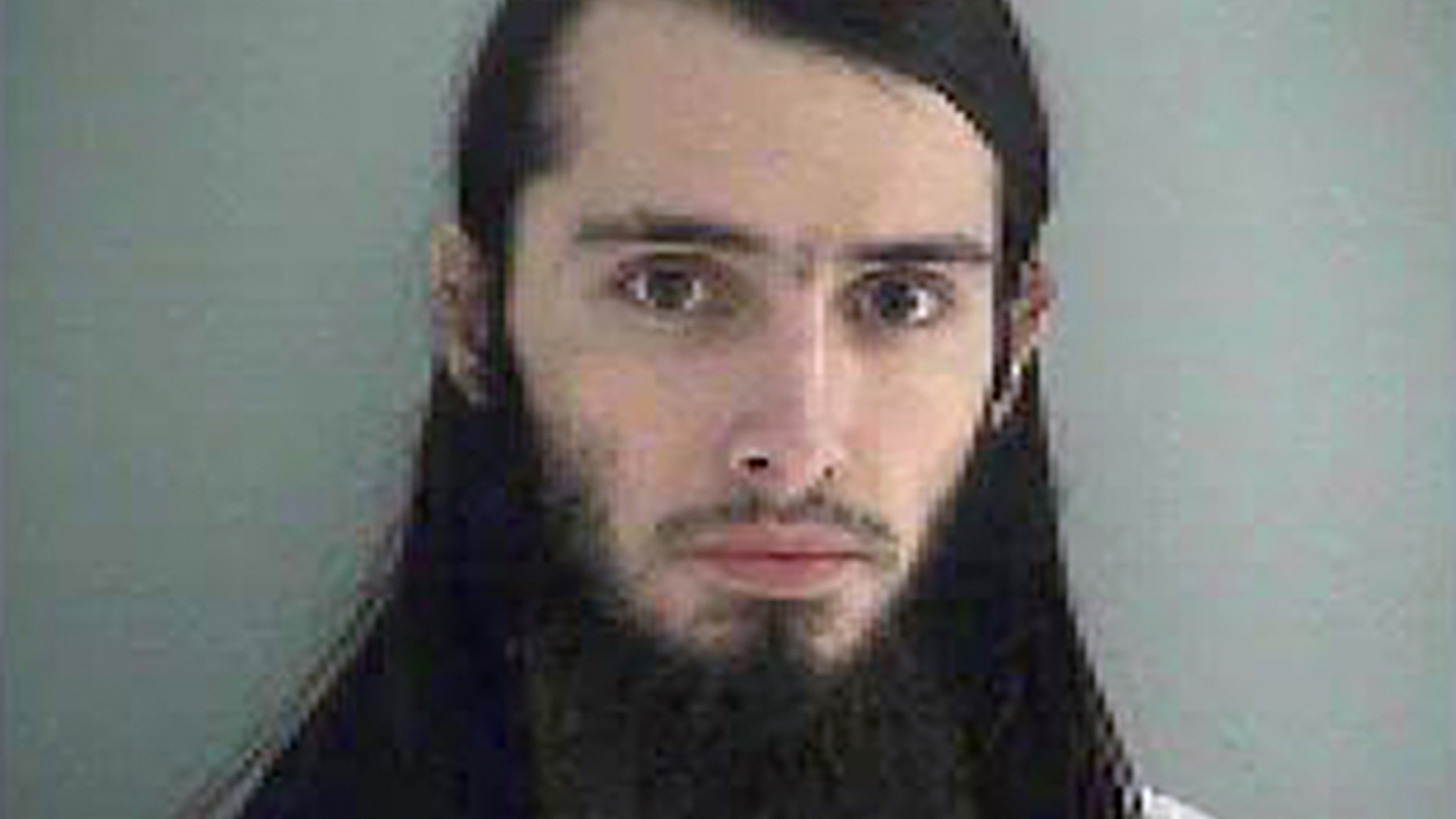 FILE - This Wednesday Jan. 14, 2015 file photo made available by the Butler County Jail shows Christopher Lee Cornell. U.S. District Judge Sandra Beckwith agreed Wednesday, April 1, 2015, to push back deadlines in the "unusual and complex" case of of Christopher Lee Cornell, an Ohio man accused of plotting to attack the U.S. Capitol. Beckwith postponed pretrial filing deadlines from April 10 to May 29 in the case of Cornell. Federal prosecutors had requested the delay, and Cornell?'s attorneys did not object. (AP Photo/Butler County Jail, File)