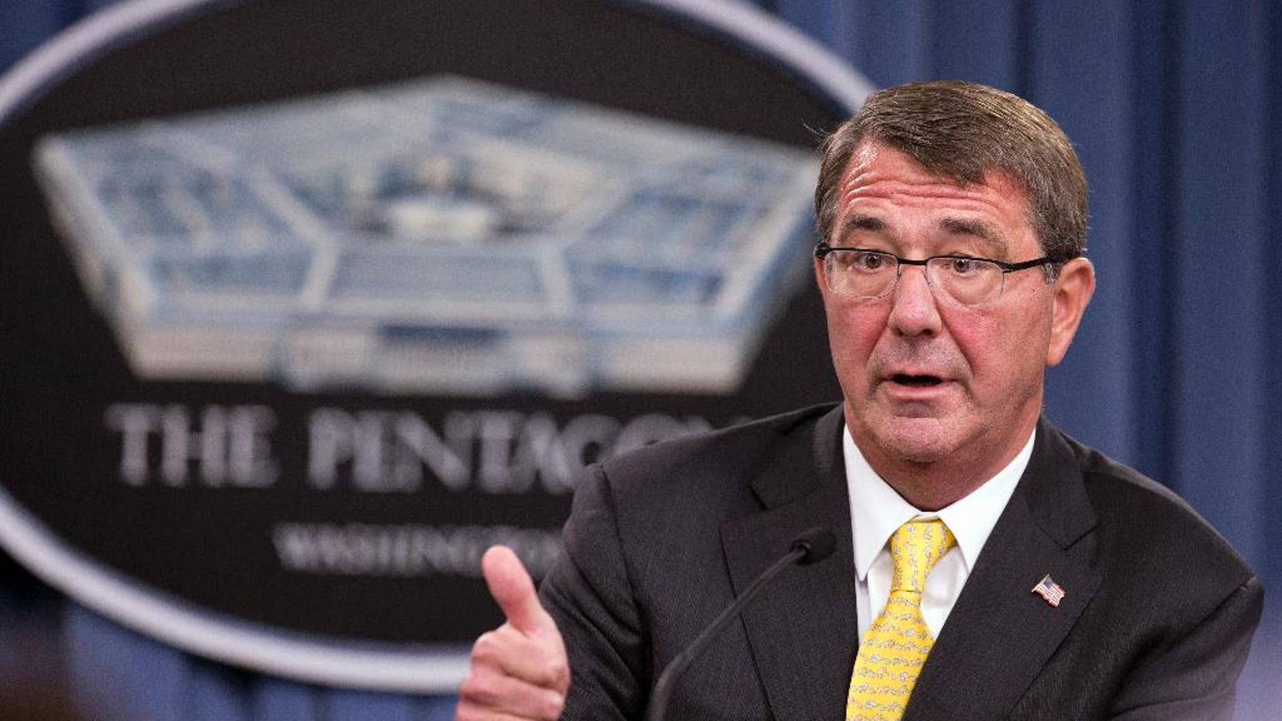FILE - In this Aug. 20, 2015 file photo, Defense Secretary Ash Carter speaks during a news conference at the Pentagon. Carter spoke with his Russian counterpart Friday, the first step in direct military talks proposed by Russia about Moscow's military buildup to support the Syrian government against the Islamic State group. (AP Photo/Manuel Balce Ceneta, File)
