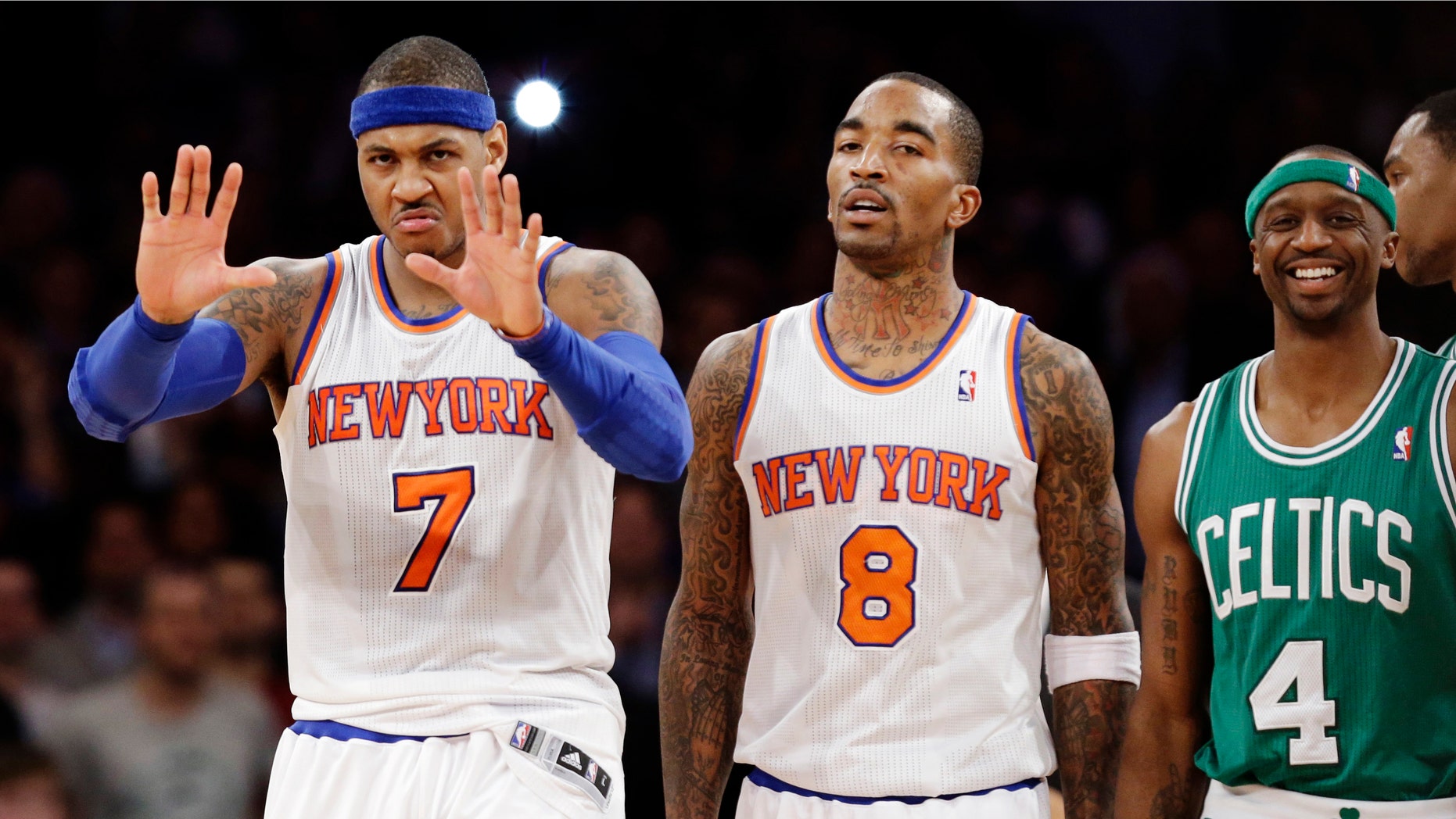 Boston Celtics guard Jason Terry (4) smiles as New York Knicks forward Carmelo Anthony (7) gestures to a referee and guard J.R. Smith (8) walks away after a play in the second half of their NBA basketball game at Madison Square Garden in New York, Monday, Jan. 7, 2013. The Celtics won 102-96. (AP Photo/Kathy Willens)