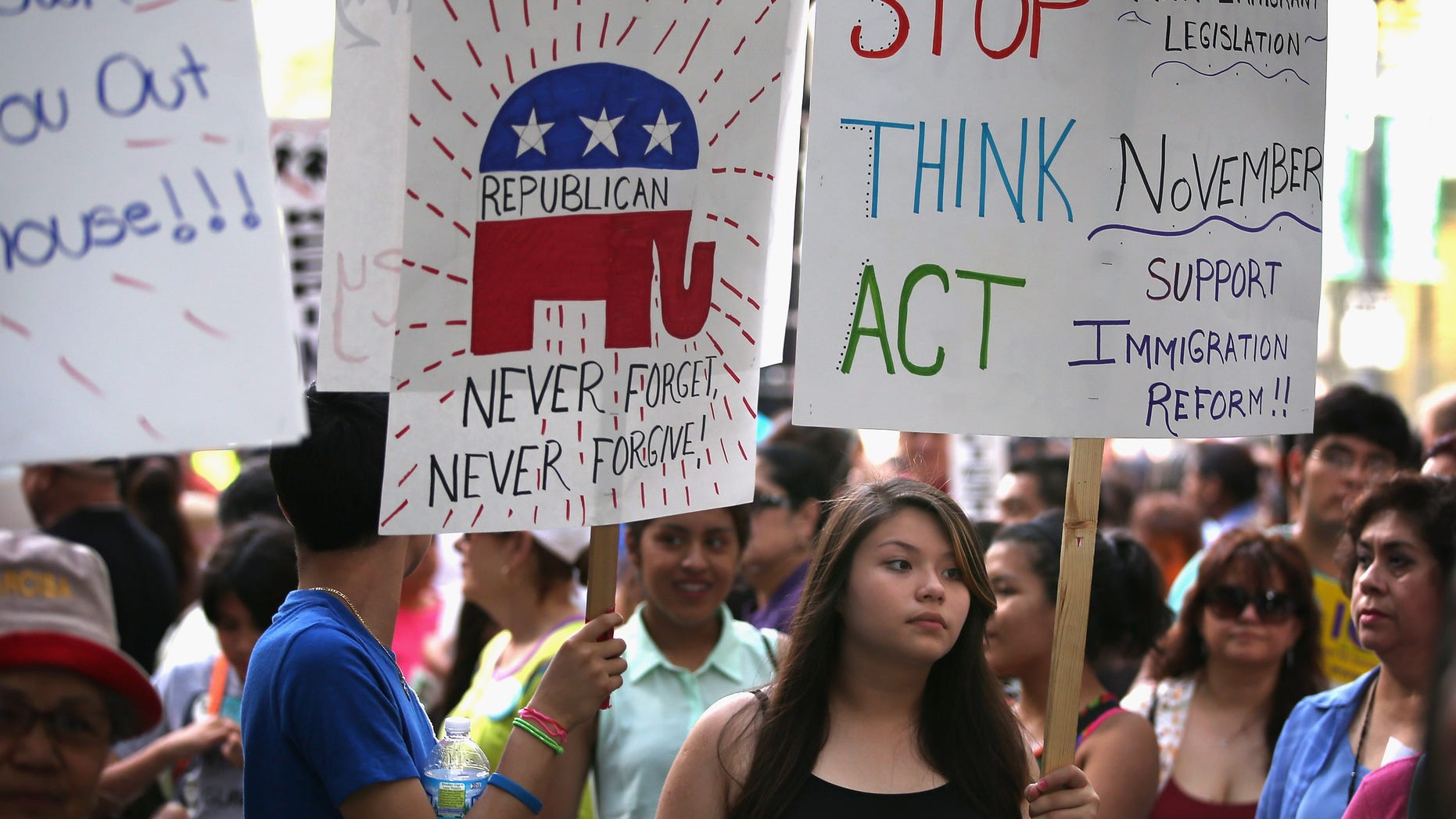 CHICAGO, IL - JUNE 27: Protestors demonstrate calling for immigration reform in front of the Illinois GOP headquarters on June 27, 2013 in Chicago, Illinois. Today the U.S. Senate passed an immigration reform bill with broad bipartisan support that would overhaul immigration laws for the first time in more than two decades. (Photo by Scott Olson/Getty Images)