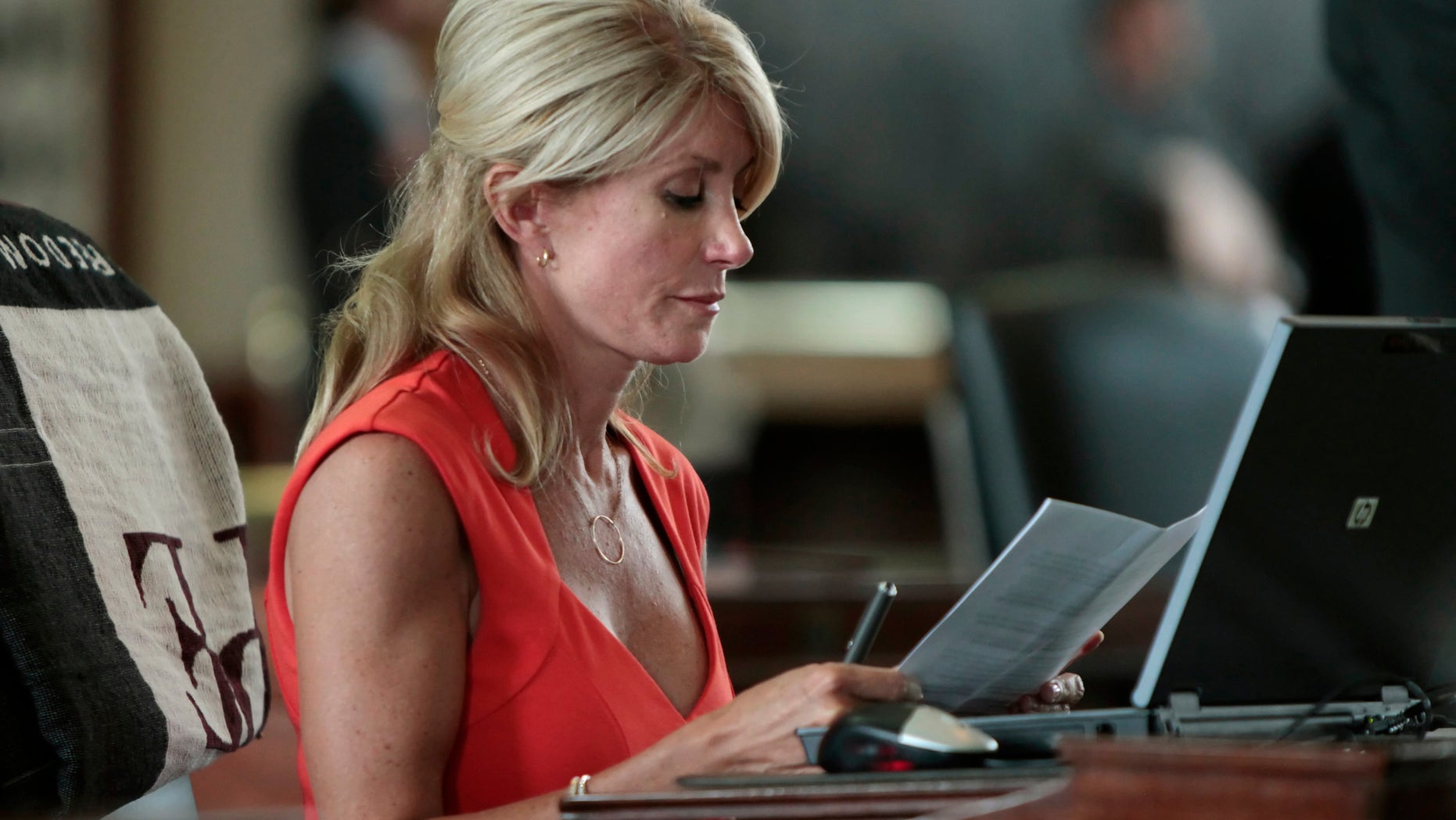 Texas Sen. Wendy Davis sits at her desk. Erich Schlegel/Getty Images.