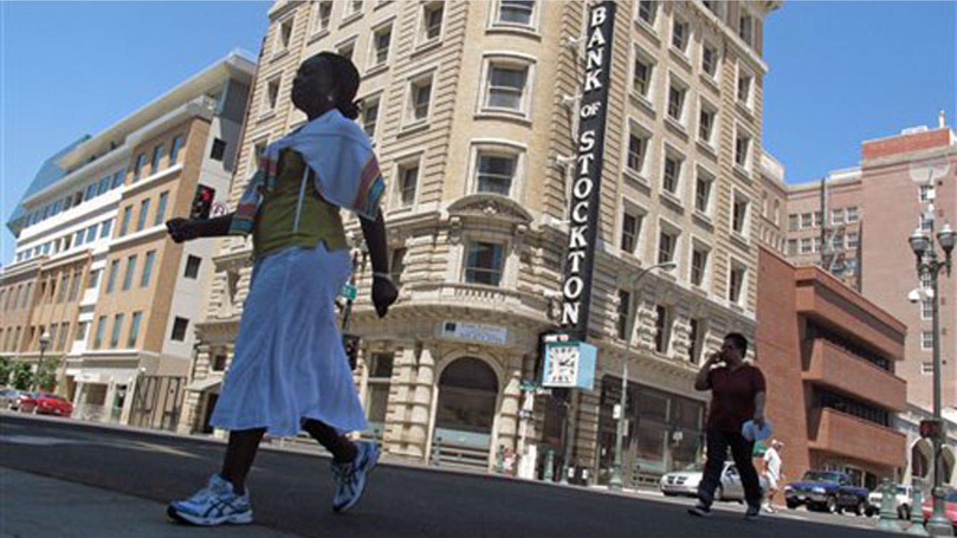 June 27, 2012: Pedestrians cross a street near the Bank of Stockton in Stockton, Calif.