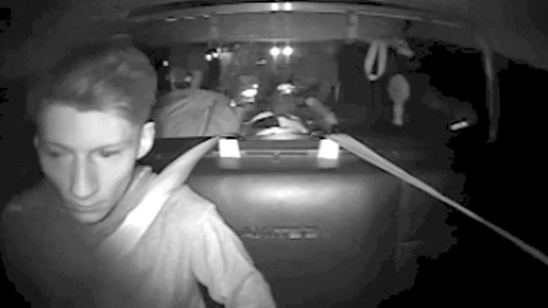 This July 30, 2016, image made from a video provided by Washington State Patrol via The Daily Herald shows Allen Ivanov in the back of a patrol car in a police camera video shortly after his arrest on Interstate 5 in Lewis County, Wash. Court documents say Ivanov, a 19-year-old man accused of fatally shooting three teenagers at a house party in Mukilteo last month, sent his friends text messages alluding to his plans, including one in which he wrote: "I'm killing everyone at a huge party." (Washington State Patrol via The Daily Herald via AP)