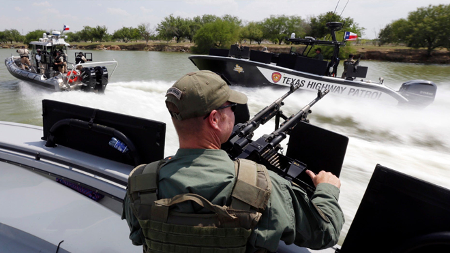 FILE - In this July 24, 2014 file photo, Texas Department of Safety Troopers patrol on the Rio Grand along the U.S.-Mexico border, in Mission, Texas. The states new Republican governor, Greg Abbott, this month approved $800 million for border security over the next two years, more than double any similar period under 14 years of Perry, and by comparison, more than the state spends on environmental regulation. (AP Photo/Eric Gay, Pool, File)