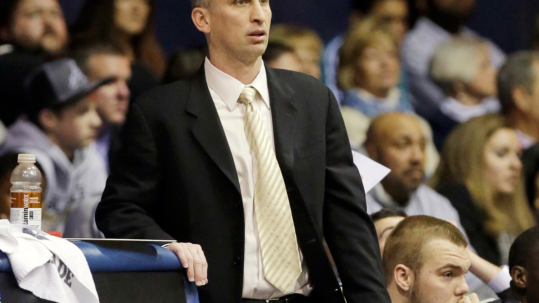 FILE - In this Feb. 2, 2013, file photo, Rhode Island assistant coach Bobby Hurley watches during the second half of an NCAA college basketball game against Butler in Indianapolis. At age 42, Hurley gets his first shot at being a head coach, at Buffalo. (AP Photo/Michael Conroy, File)