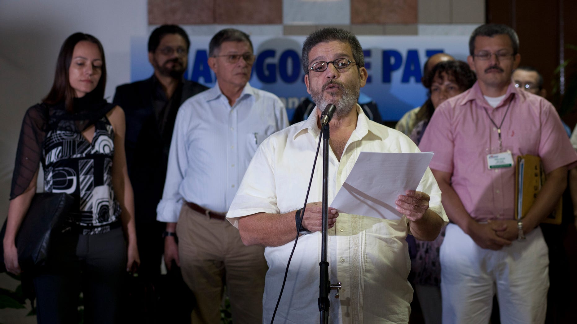 Marco Leon Calarca, member of the Revolutionary Armed Forces of Colombia, or FARC, talks to reporters during the continuation of peace talks with Colombia's government, in Havana, Cuba, Monday, Feb. 4, 2013. (AP Photo/Ramon Espinosa)