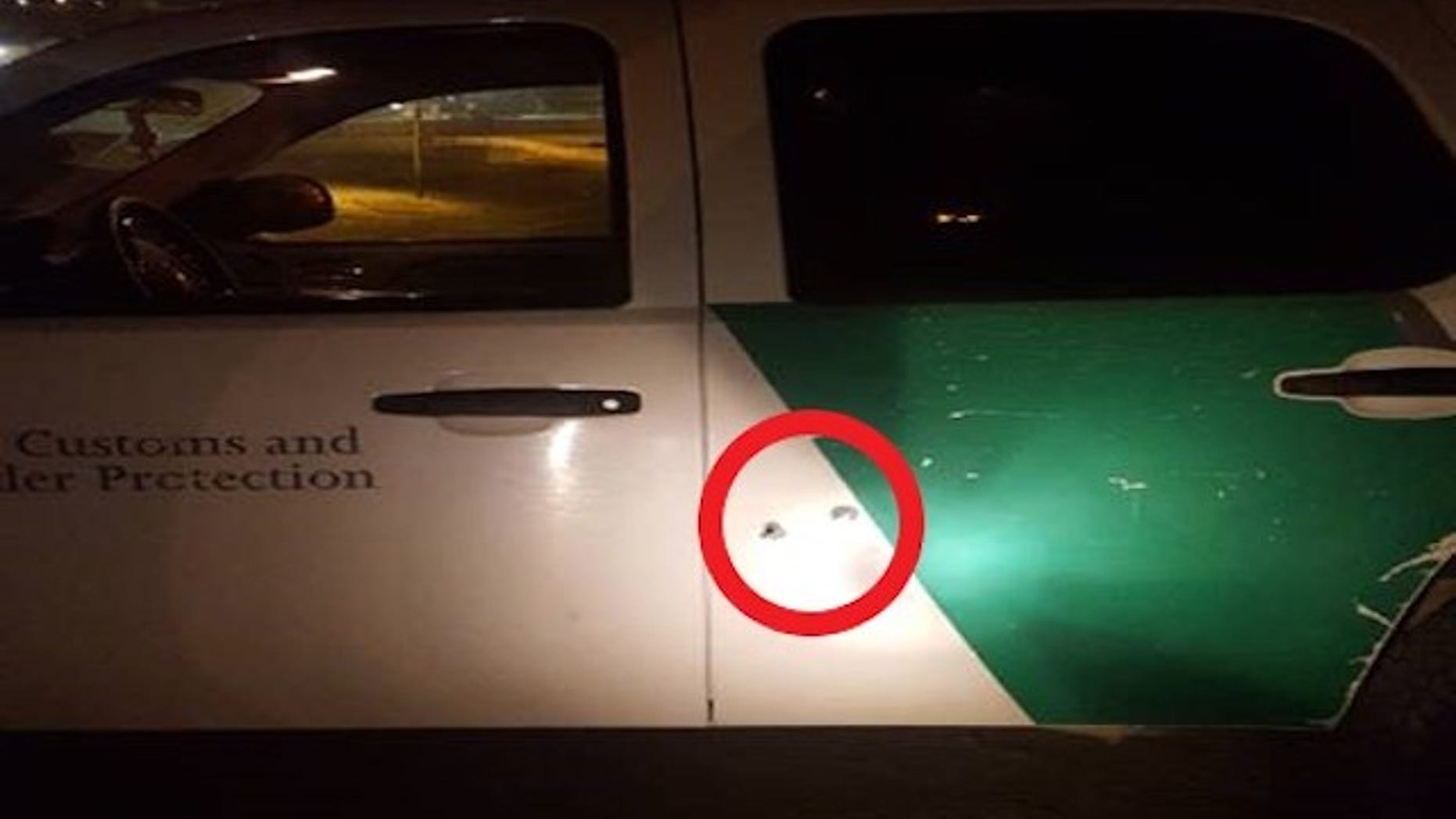 U.S. Customs and Border Protection San Diego tweeted out this image of bullet holes in the side of an agent's SUV.