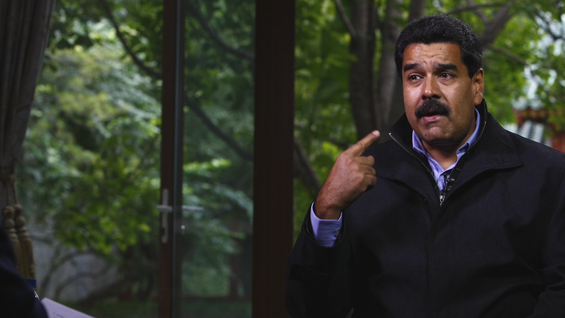 BEIJING, CHINA - SEPTEMBER 23: (CHINA OUT) Venezuelan President Nicolas Maduro Moros is interviewed by Chinatoday, Chinadaily and CCTV at Diaoyutai State Guesthouse on September 23, 2013 in Beijing, China. (Photo by ChinaFotoPress/Getty Images)