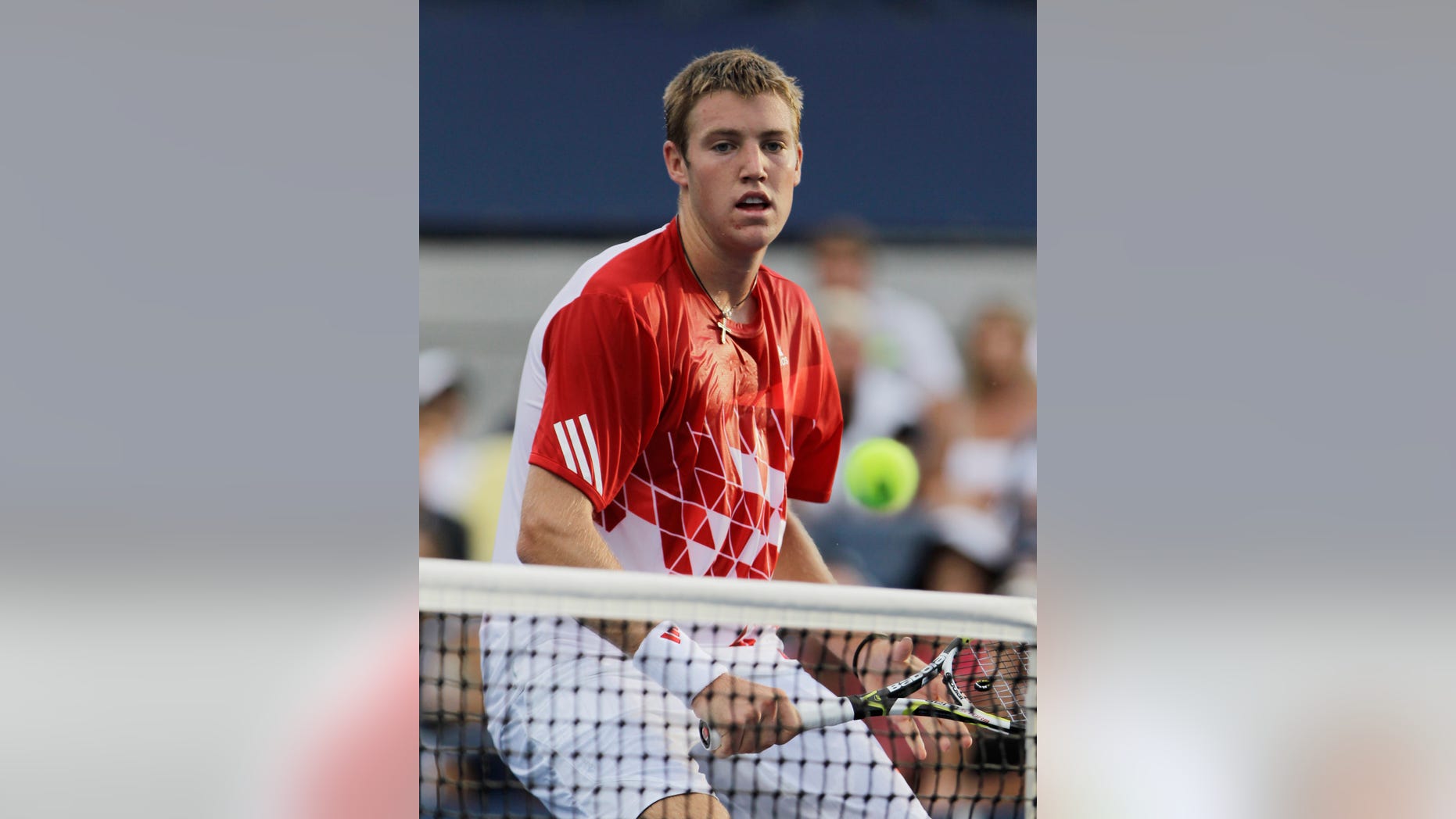 FILE - In this Aug. 31, 2011, file photo, Jack Sock, of the United States, returns a shot to Marc Gicquel of France, during the U.S. Open tennis tournament in New York. Sock qualified for the French Open tennis tournament, which starts Sunday. AP Photo/Julio Cortez, File)