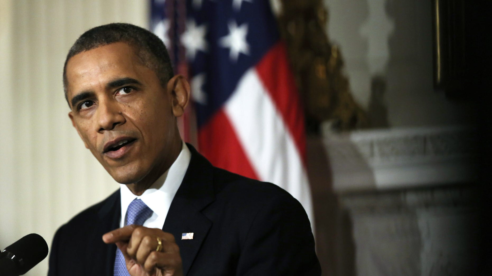 WASHINGTON, DC - OCTOBER 17: U.S. President Barack Obama makes a statement at the State Dining Room of the White House October 17, 2013 in Washington, DC. Obama said the American people are completely fed up with Washington and called on cooperation to work things out. (Photo by Alex Wong/Getty Images)