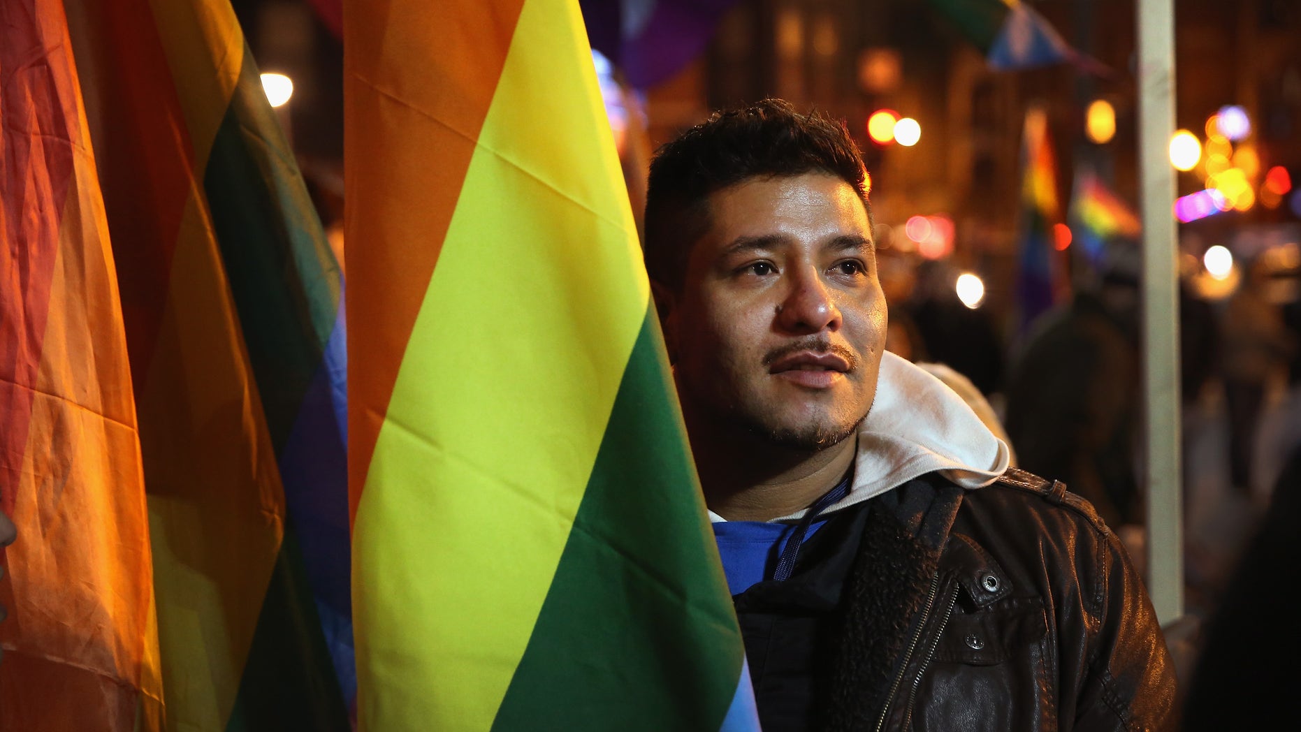 CHICAGO, IL - NOVEMBER 07: Ismael Enriquez joins other supporters of same-sex marriage at a rally to celebrate Illinois General Assembly's passing of a gay marriage bill on November 7, 2013 in Chicago, Illinois. The governor is expected to sign the bill on November 20, making Illinois the 15th state to legalize same-sex unions. (Photo by Scott Olson/Getty Images)