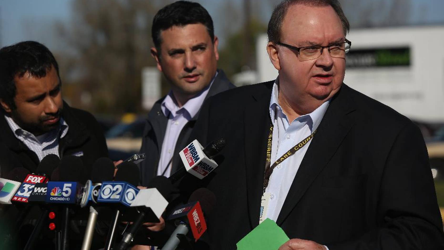 Lake County Sheriff John Buncich talks to reporters following the first court appearance for serial murder suspect Darren Vann, Wednesday, Oct. 22, 2014 in Crown Point, Ind. (AP Photo/The Times, John J. Watkins)