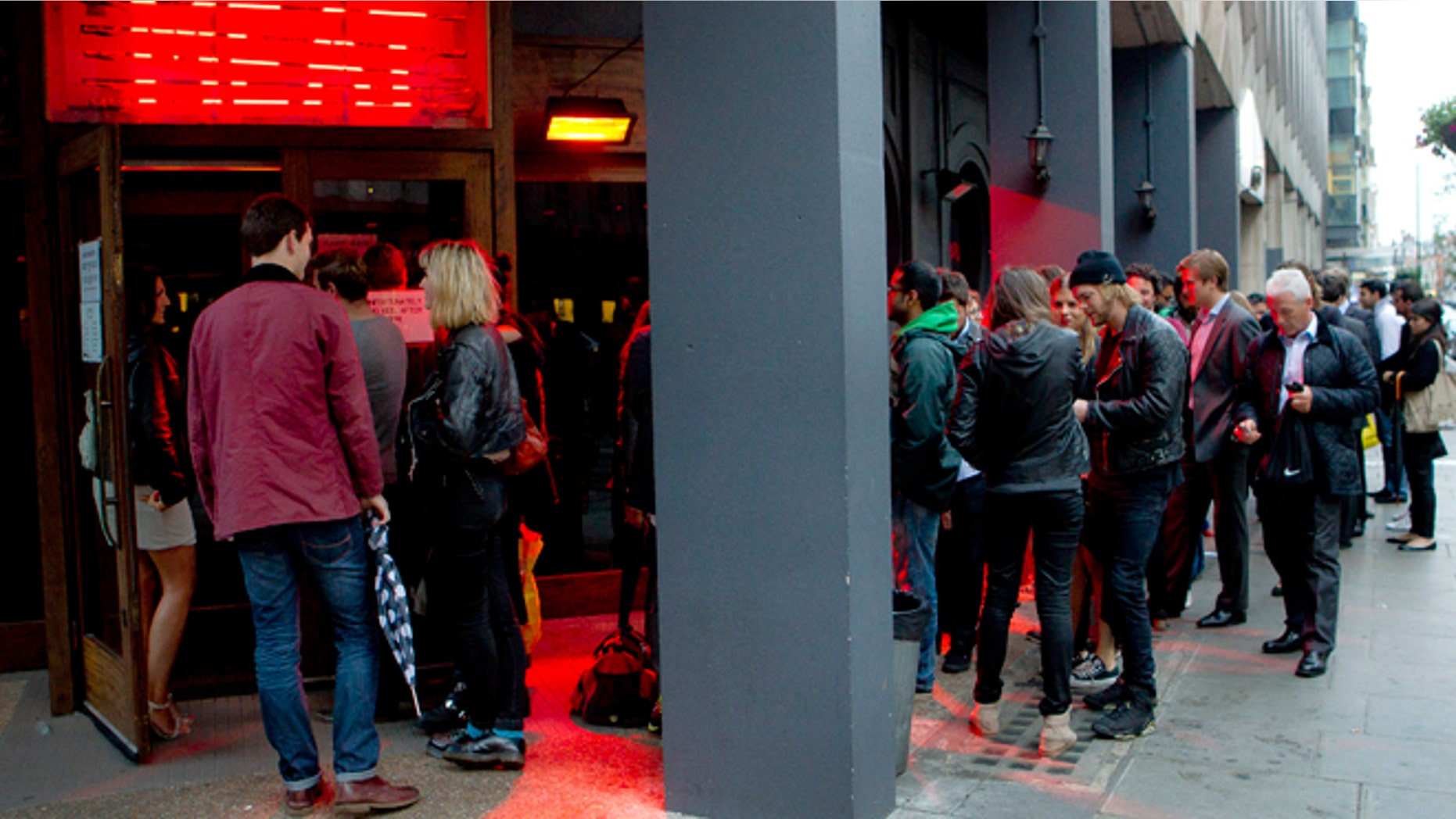 July 10, 2012: Customers form a queue as they wait to be seated in the Meat Liquor restaurant on Welbeck Street in central London.