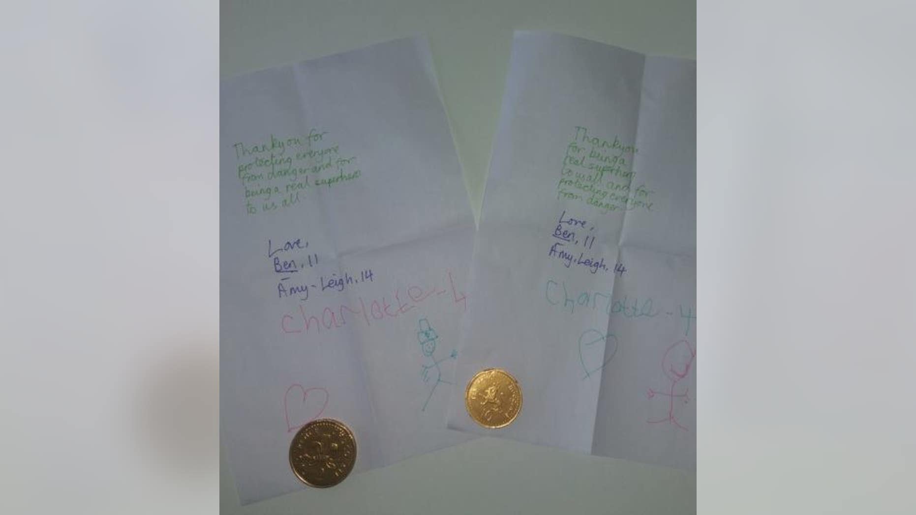 The notes for Manchester police came with chocolate coins.